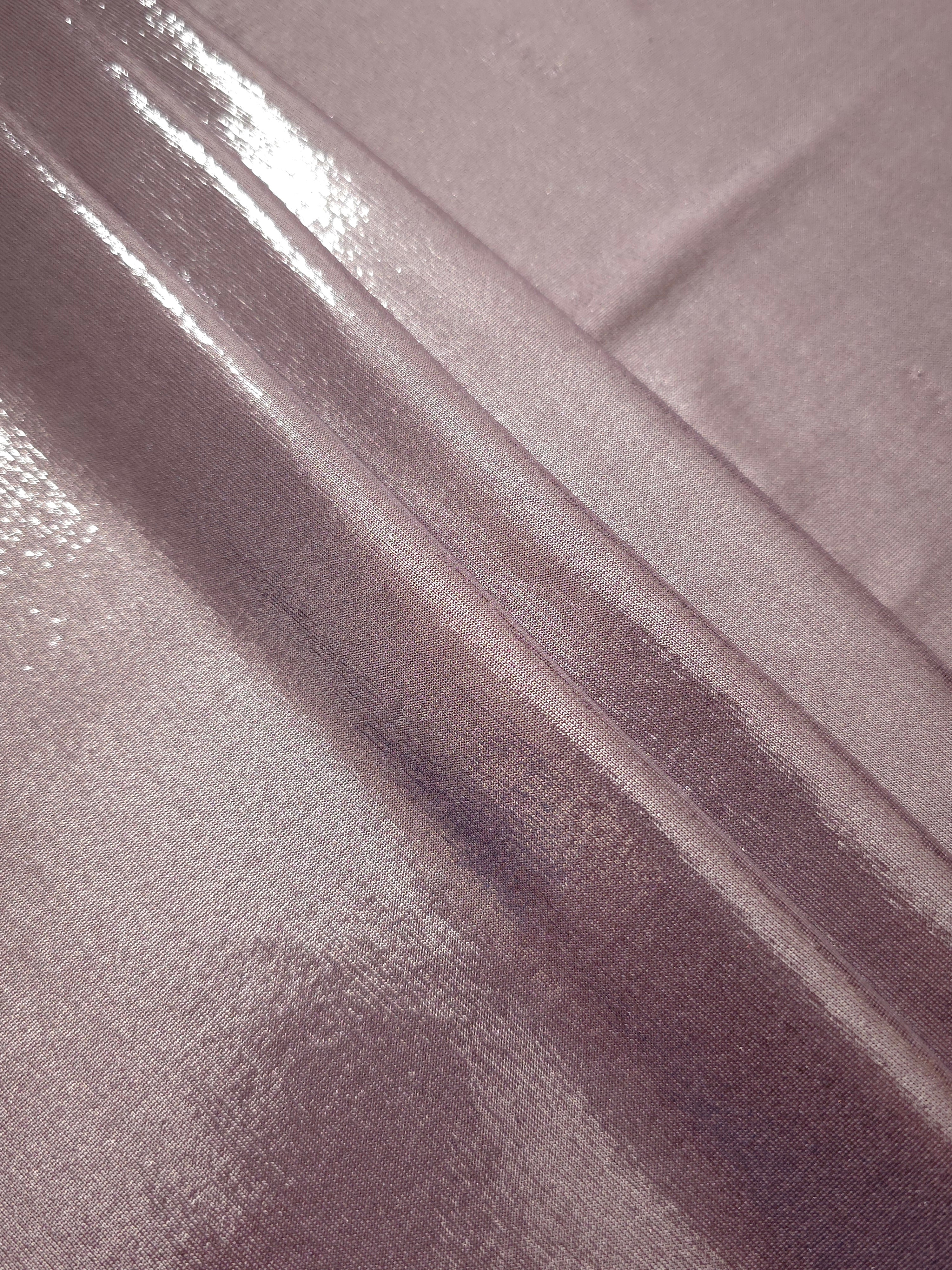 Layered folds of Dusty Rose Mauve foiled stretch fabric showing shimmer, body and movement for performance outfits and statement garments