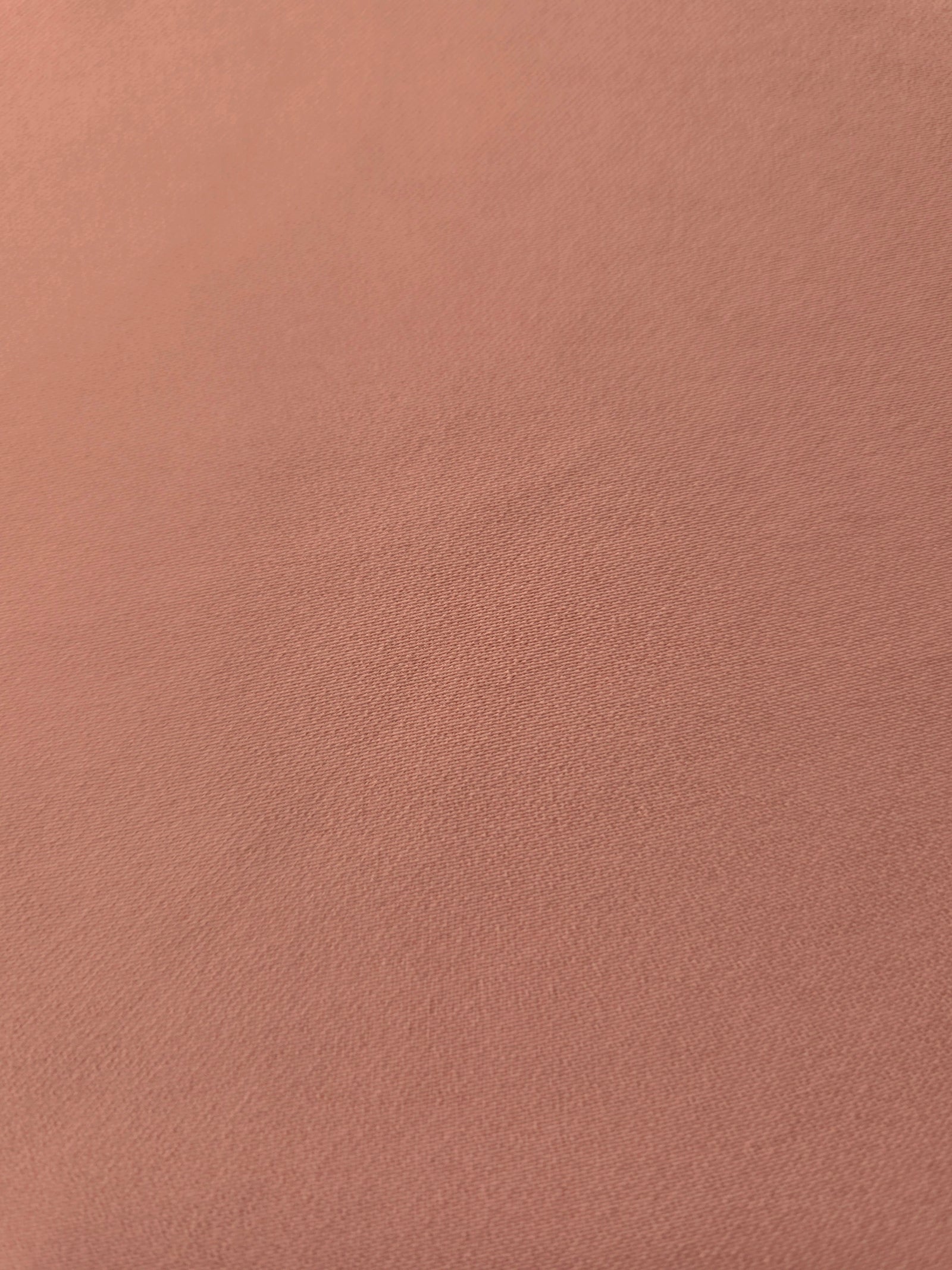 Dusty Rose Taupe mechanical polyester crepe in close-up, showing fine woven texture and a silky-soft surface