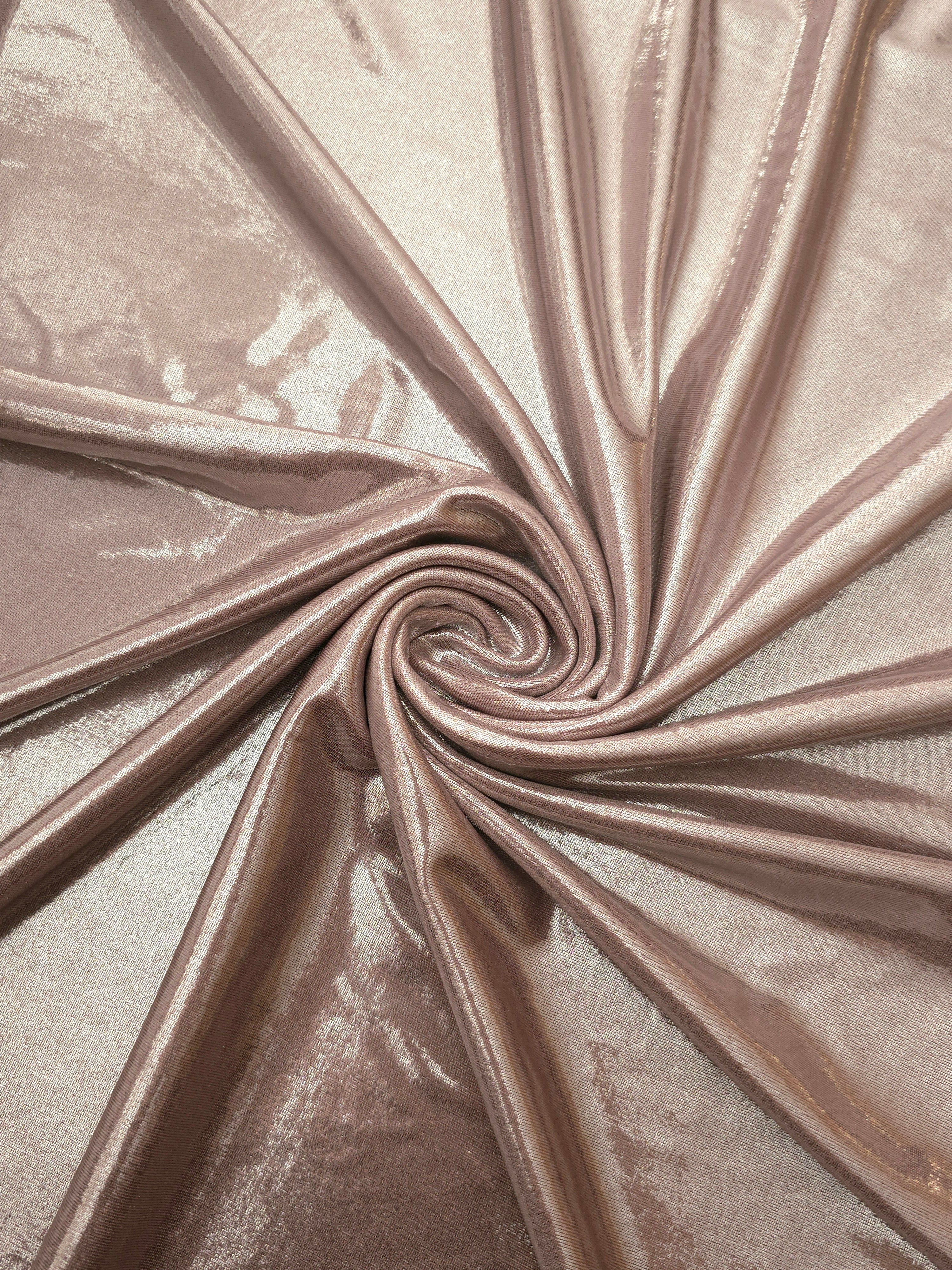 Spiraled Dusty Rose Taupe shimmer spandex fabric showing reflective movement for evening dresses, costumes and performance apparel