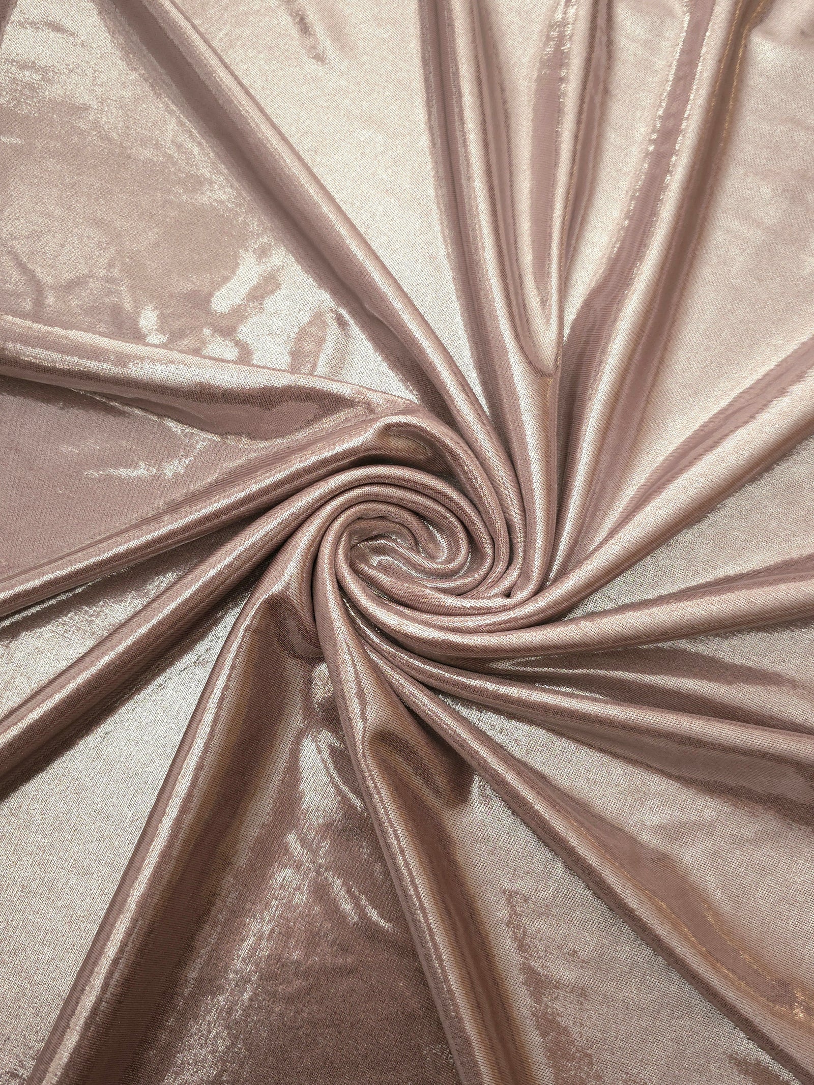 Spiraled Dusty Rose Taupe shimmer spandex fabric showing reflective movement for evening dresses, costumes and performance apparel