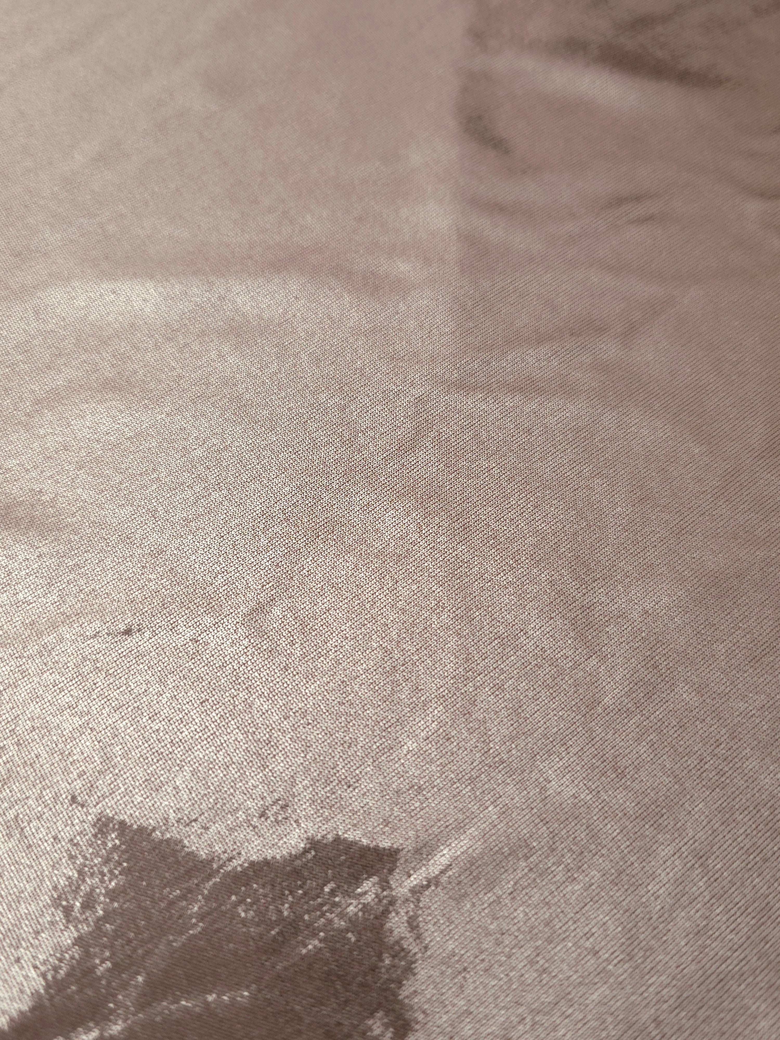 Texture view of Dusty Rose Taupe metallic stretch fabric, highlighting foil shimmer and surface detail for performance apparel