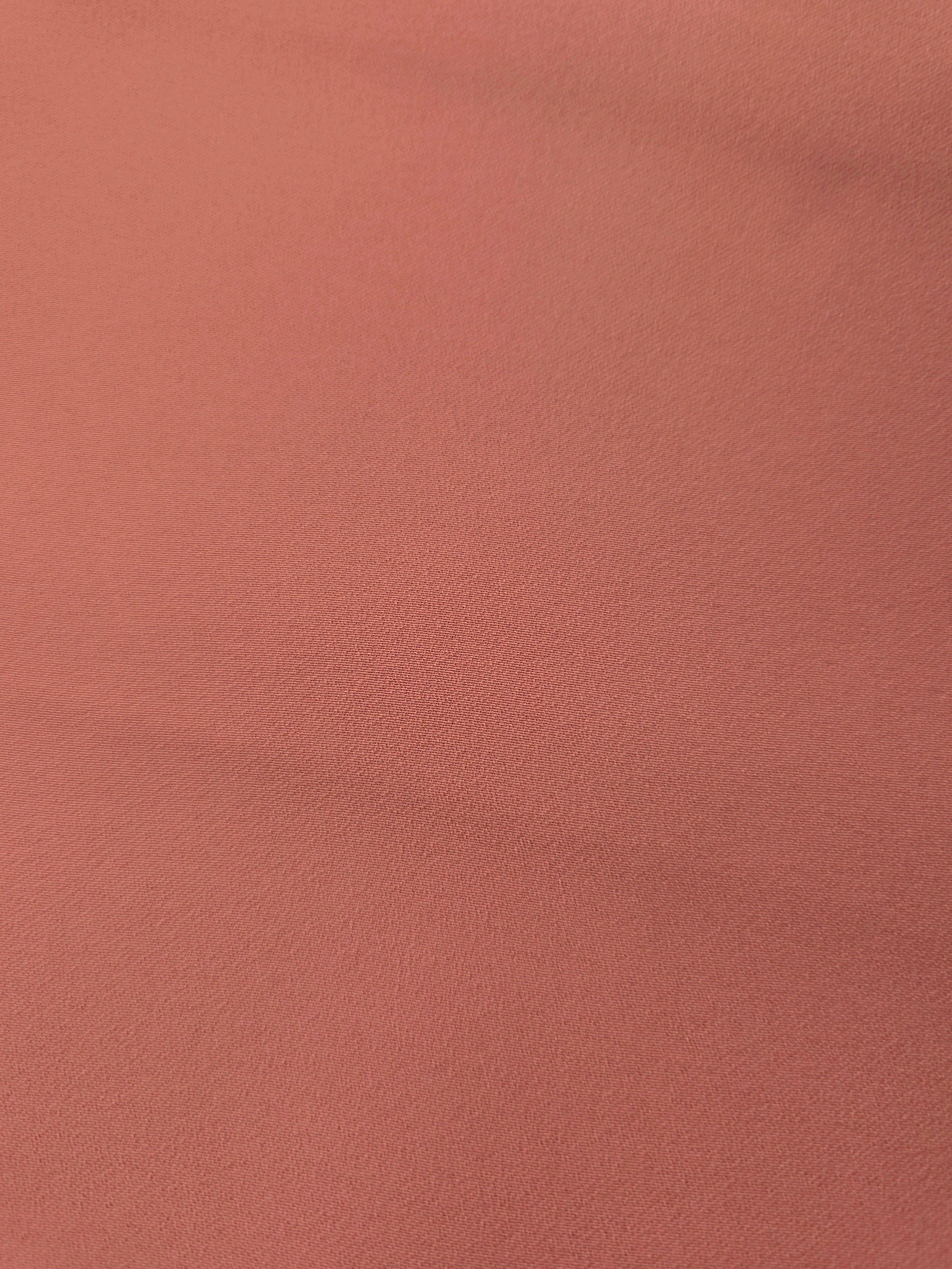Dusty Terracotta mechanical polyester crepe in close-up, showing fine woven texture and a silky-feel surface