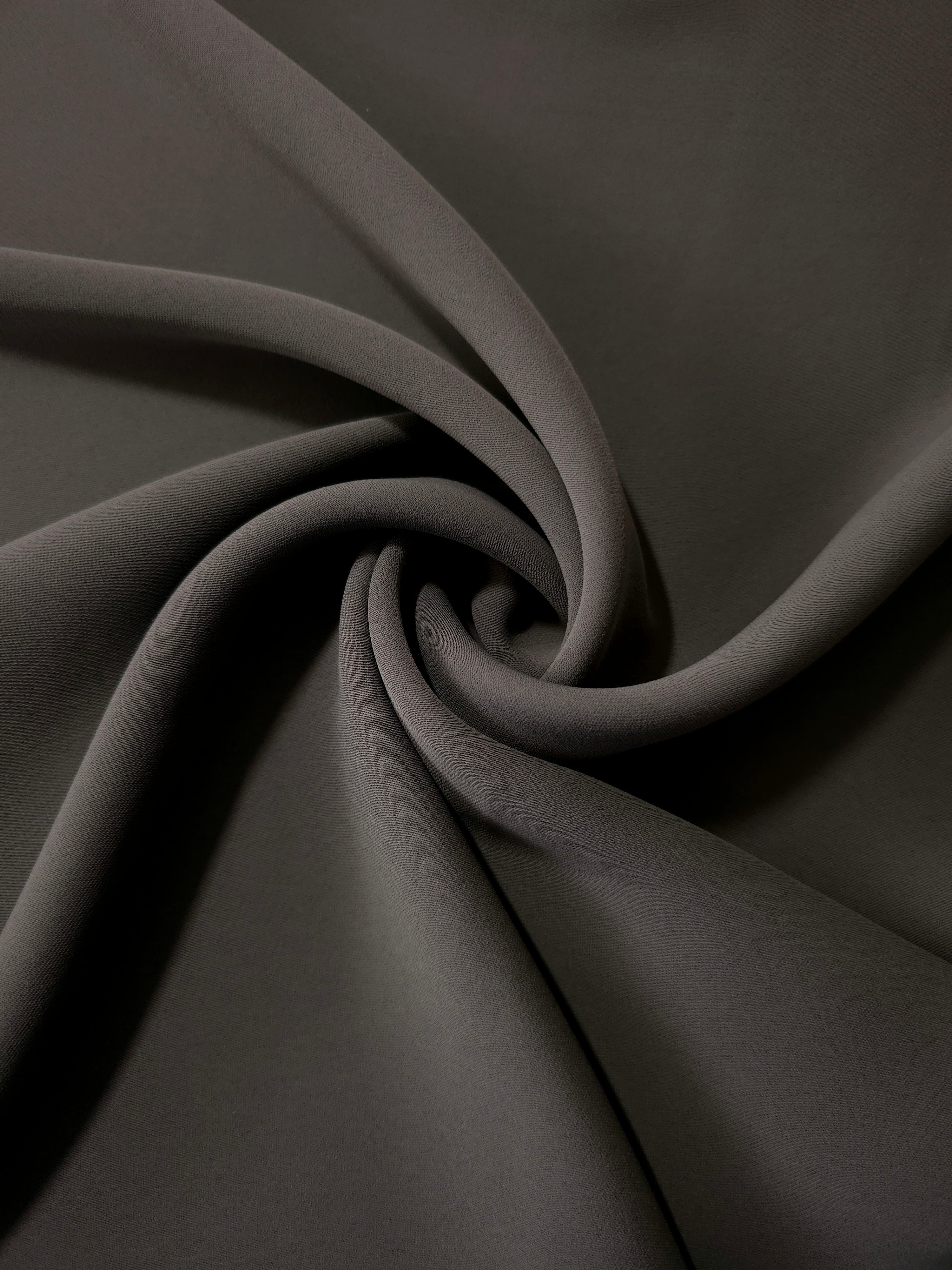Swirled Espresso Taupe Korean crepe showing fluid movement and silky drape for dresses and occasionwear