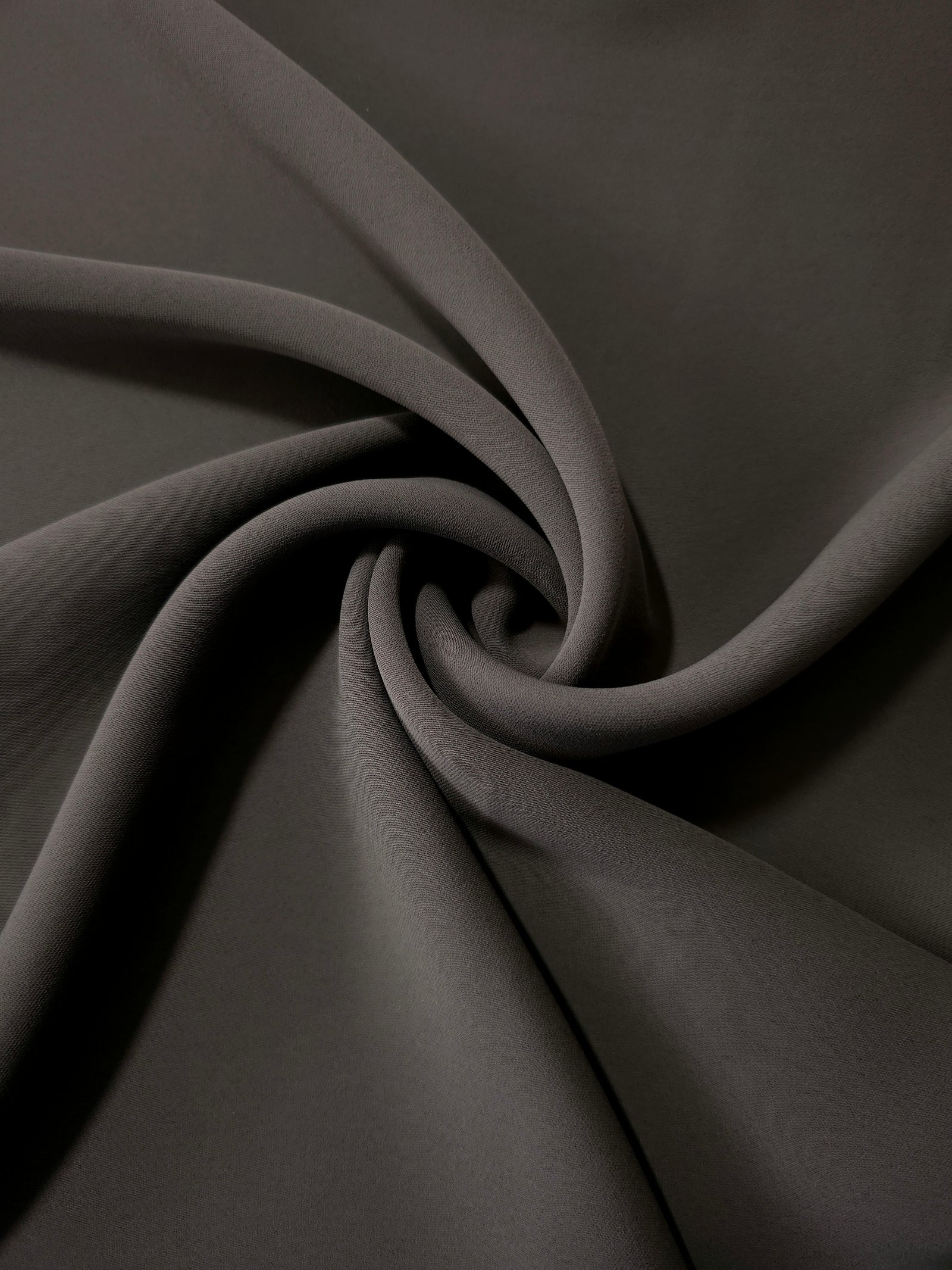 Swirled Espresso Taupe Korean crepe showing fluid movement and silky drape for dresses and occasionwear