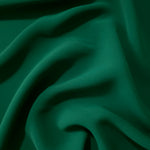 Forest Green Korean crepe displayed in fluid draped folds for eveningwear, skirts and flowing garments