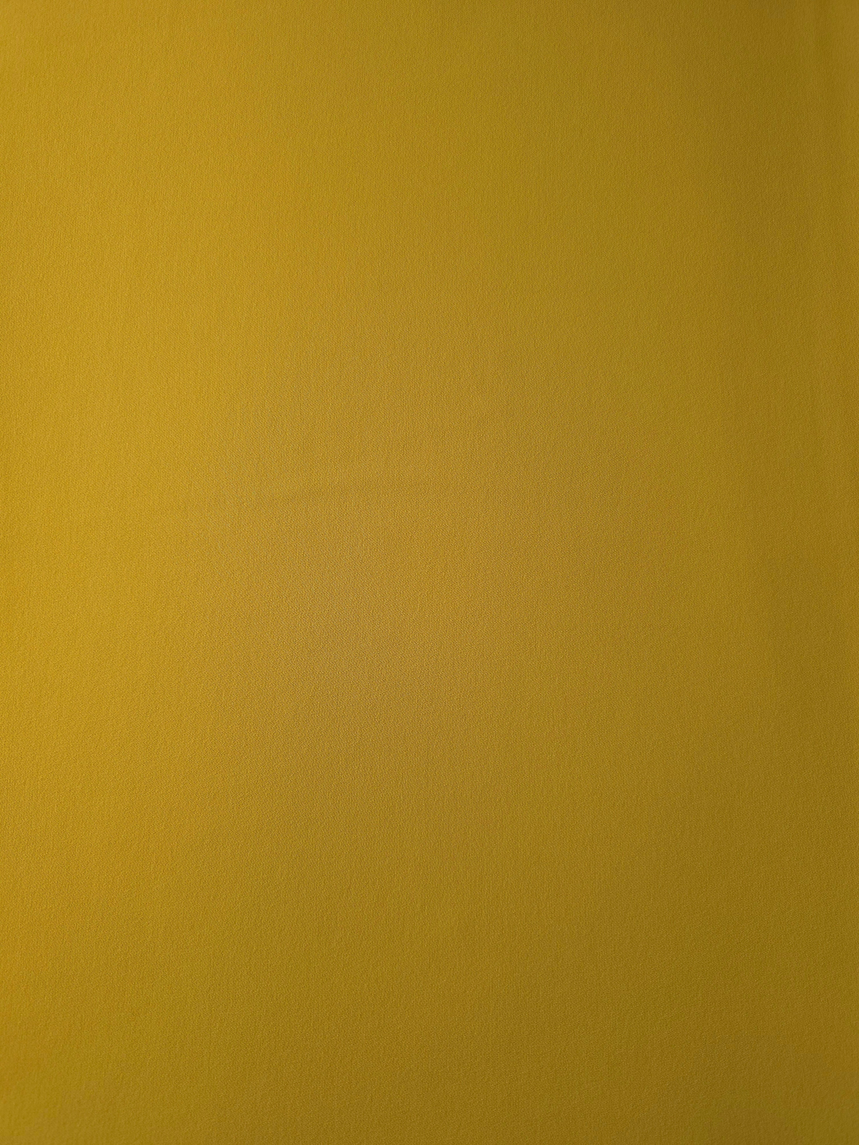 Golden Ochre opaque Korean polyester crepe shown flat, 205 GSM smooth woven fabric for dressmaking