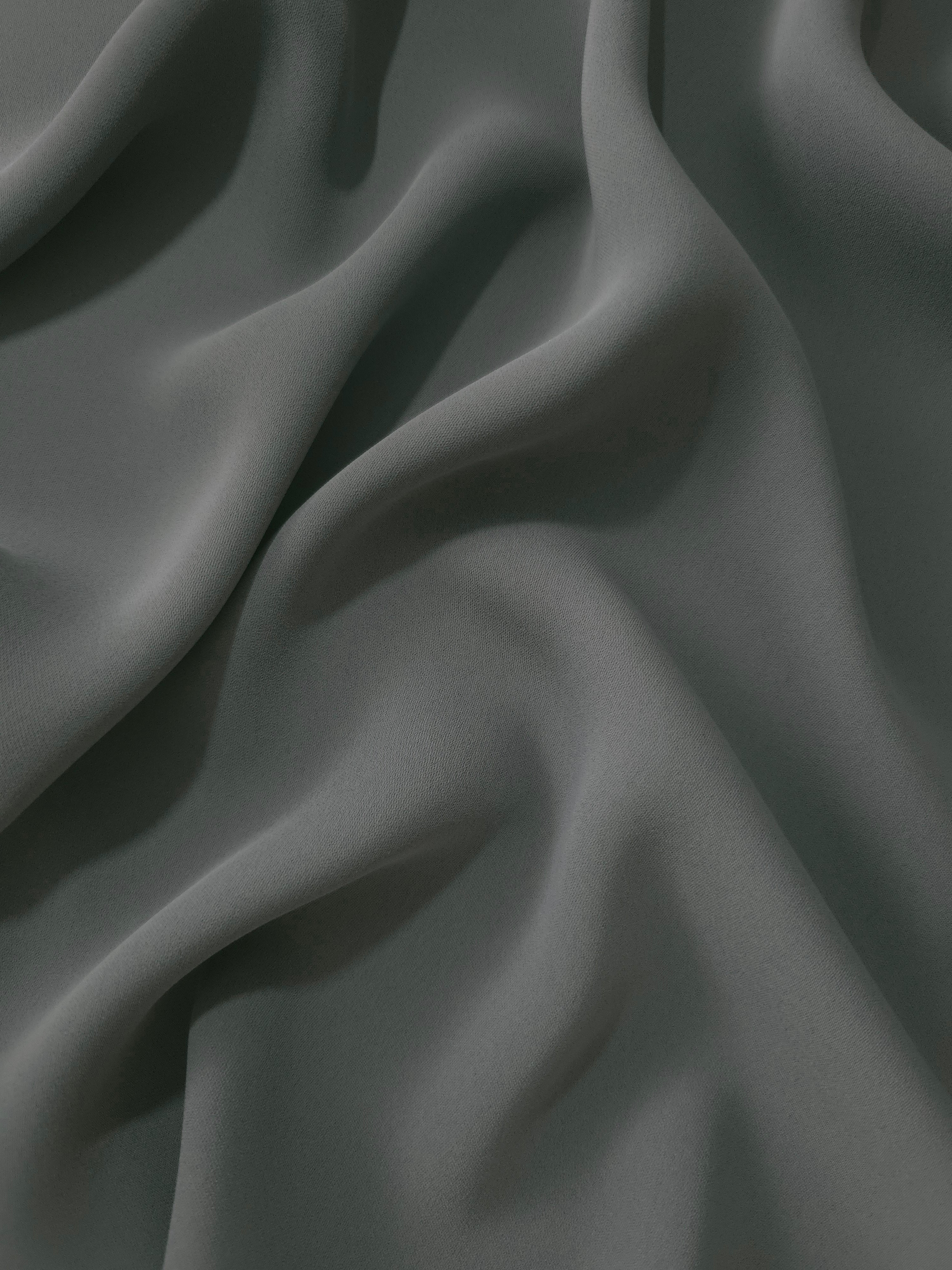 Draped Graphite Gray polyester crepe showing fluid folds for evening dresses, occasionwear and elegant apparel
