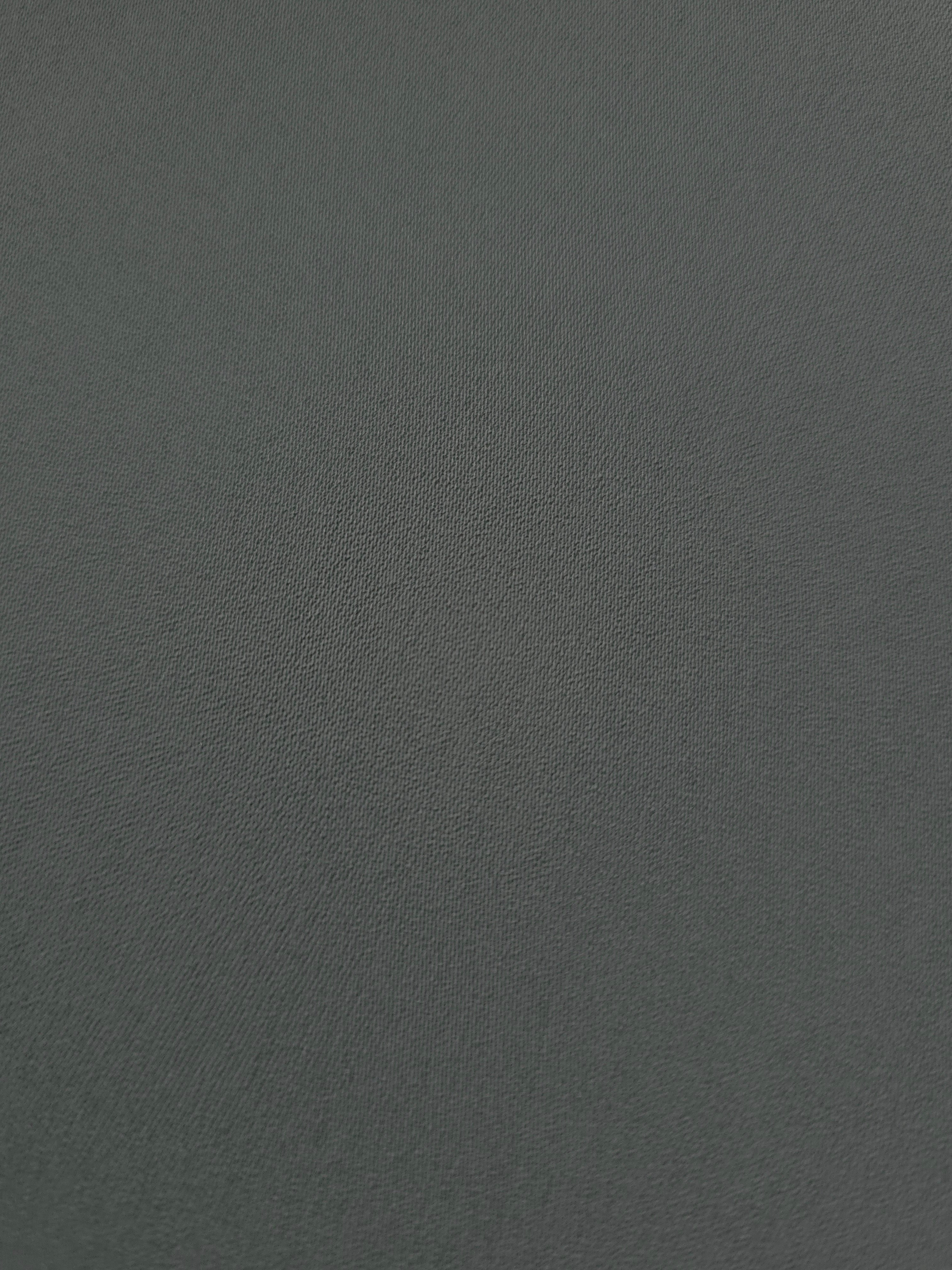 Close-up of Graphite Gray mechanical polyester crepe showing fine woven texture and a smooth silky-soft hand