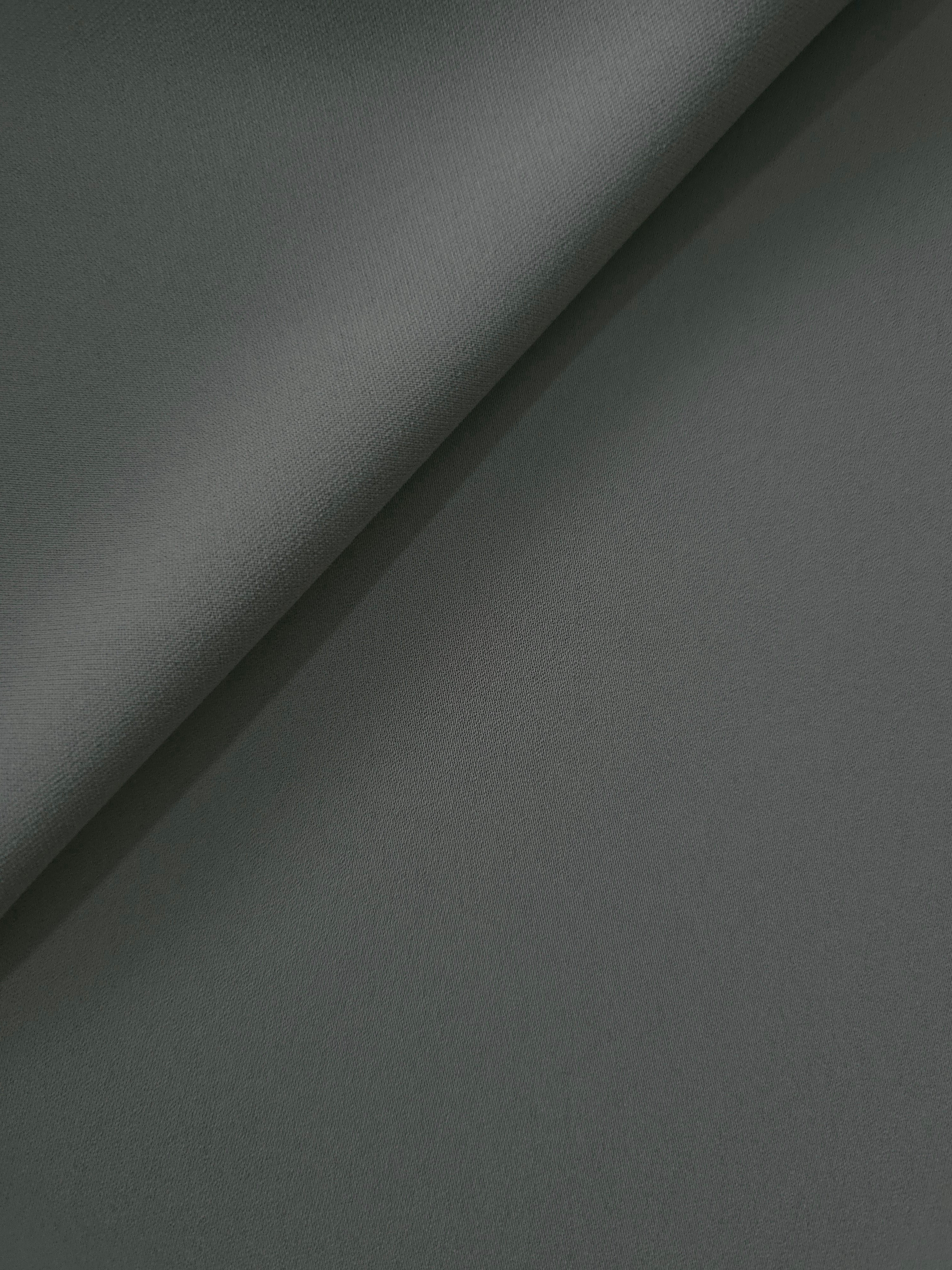Graphite Gray Italian crepe in a soft fold, showing fluid drape for blouses, dresses and flowing skirts