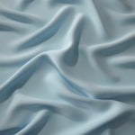 Fluid folds of Ice Blue opaque Korean crepe, a dress fabric suited to eveningwear and flowing skirts