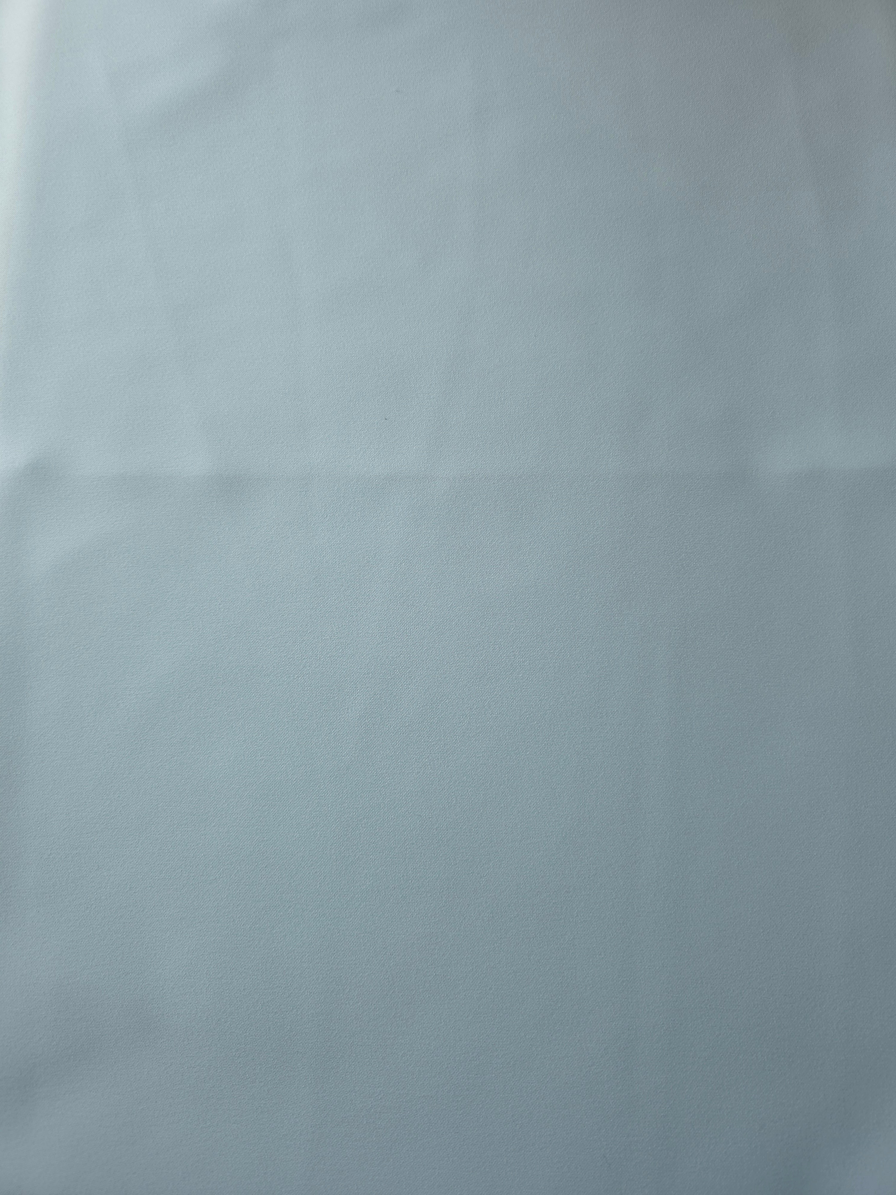 Ice Blue Korean crepe fabric shown flat, 205 GSM opaque polyester with a smooth surface and silky-soft hand