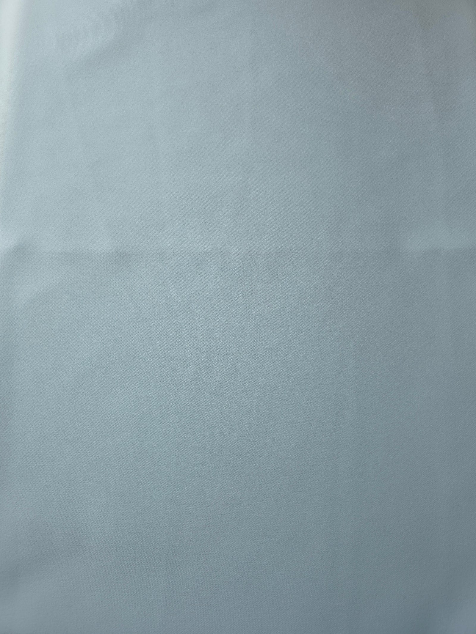 Ice Blue Korean crepe fabric shown flat, 205 GSM opaque polyester with a smooth surface and silky-soft hand