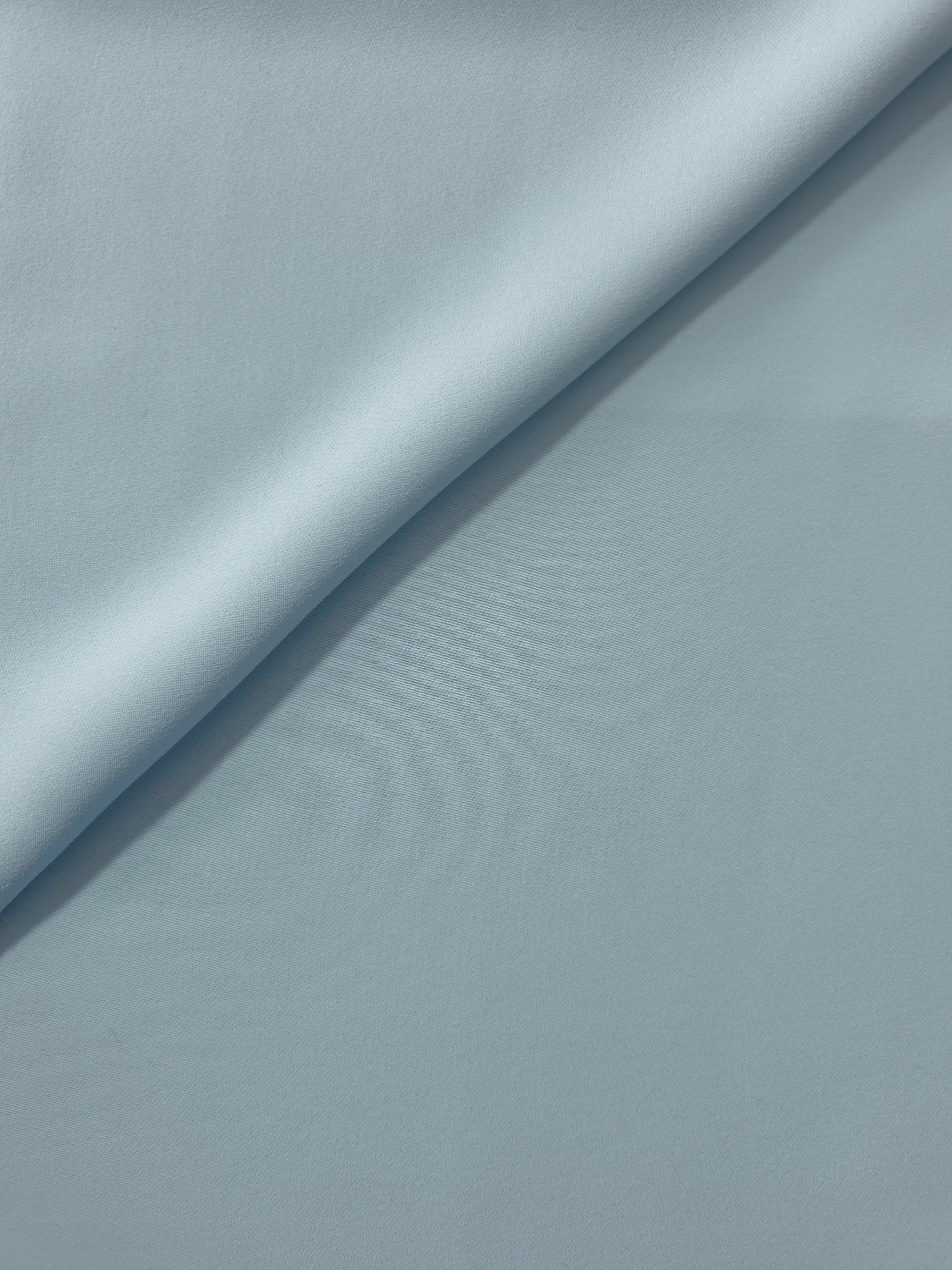 Ice Blue silky-soft Korean crepe folded loosely to show fluid drape for blouses and occasionwear separates