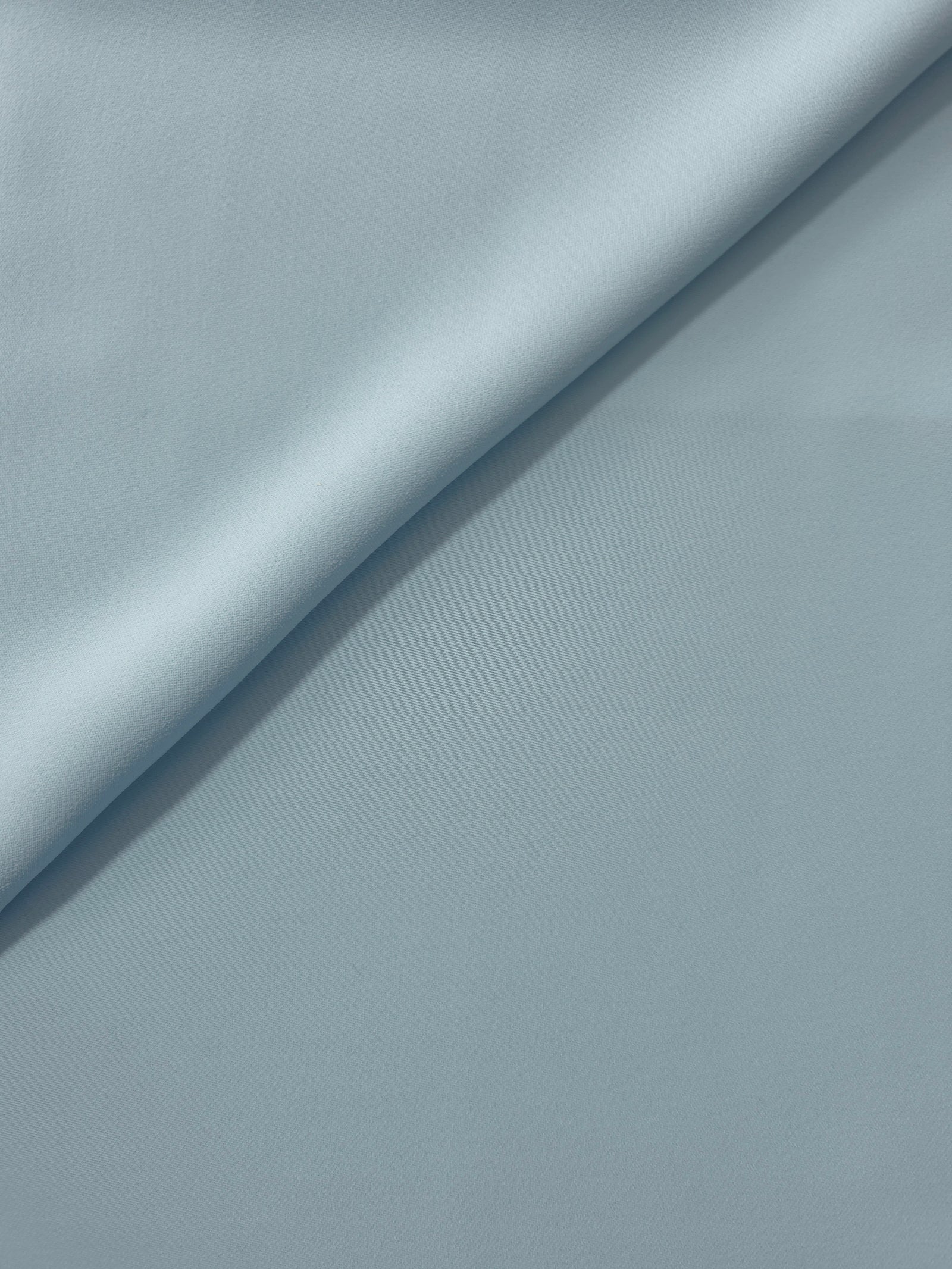 Ice Blue silky-soft Korean crepe folded loosely to show fluid drape for blouses and occasionwear separates