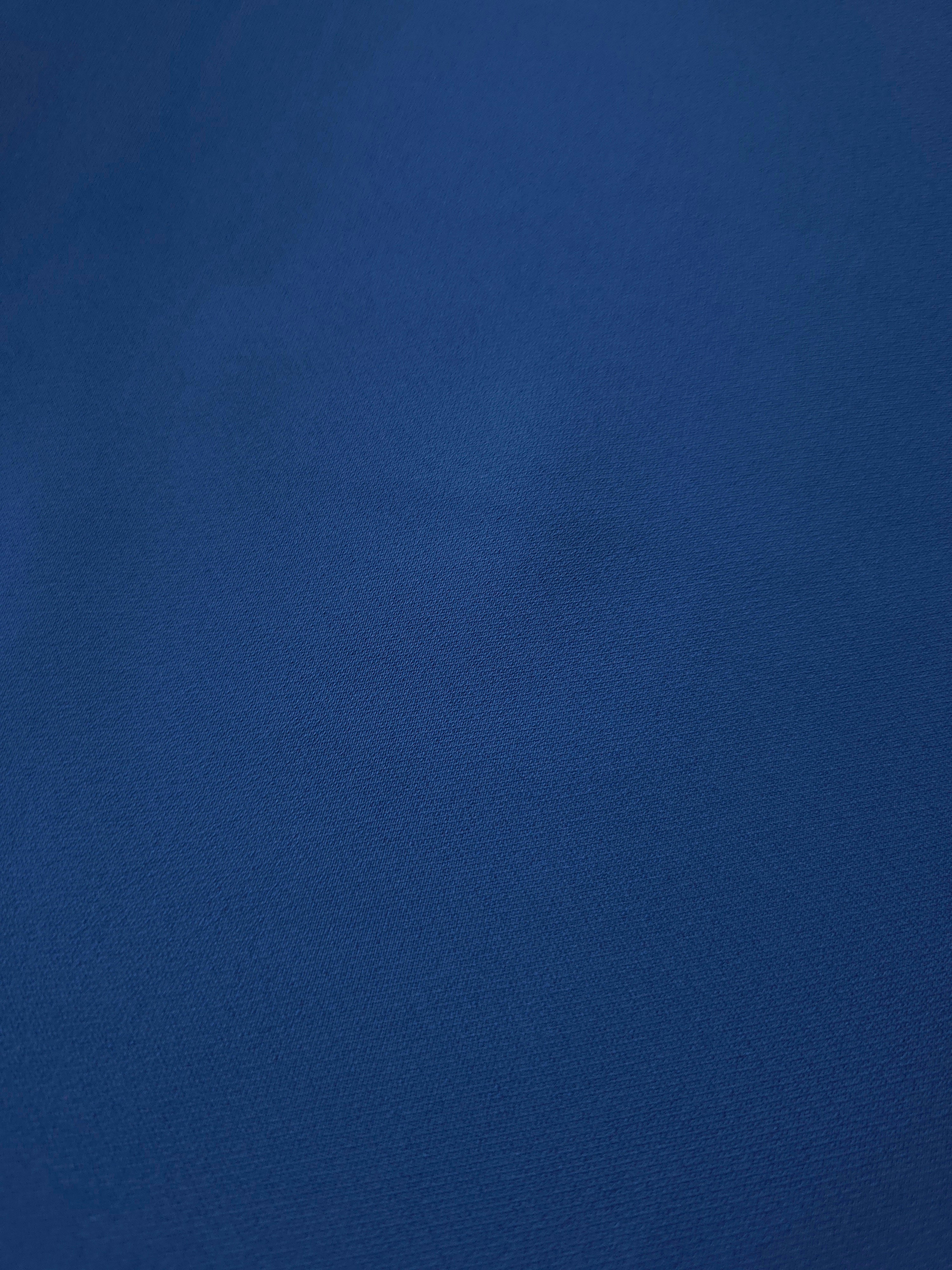 Close-up of Indigo Navy Blue mechanical polyester crepe showing fine woven texture and a smooth silky-soft hand