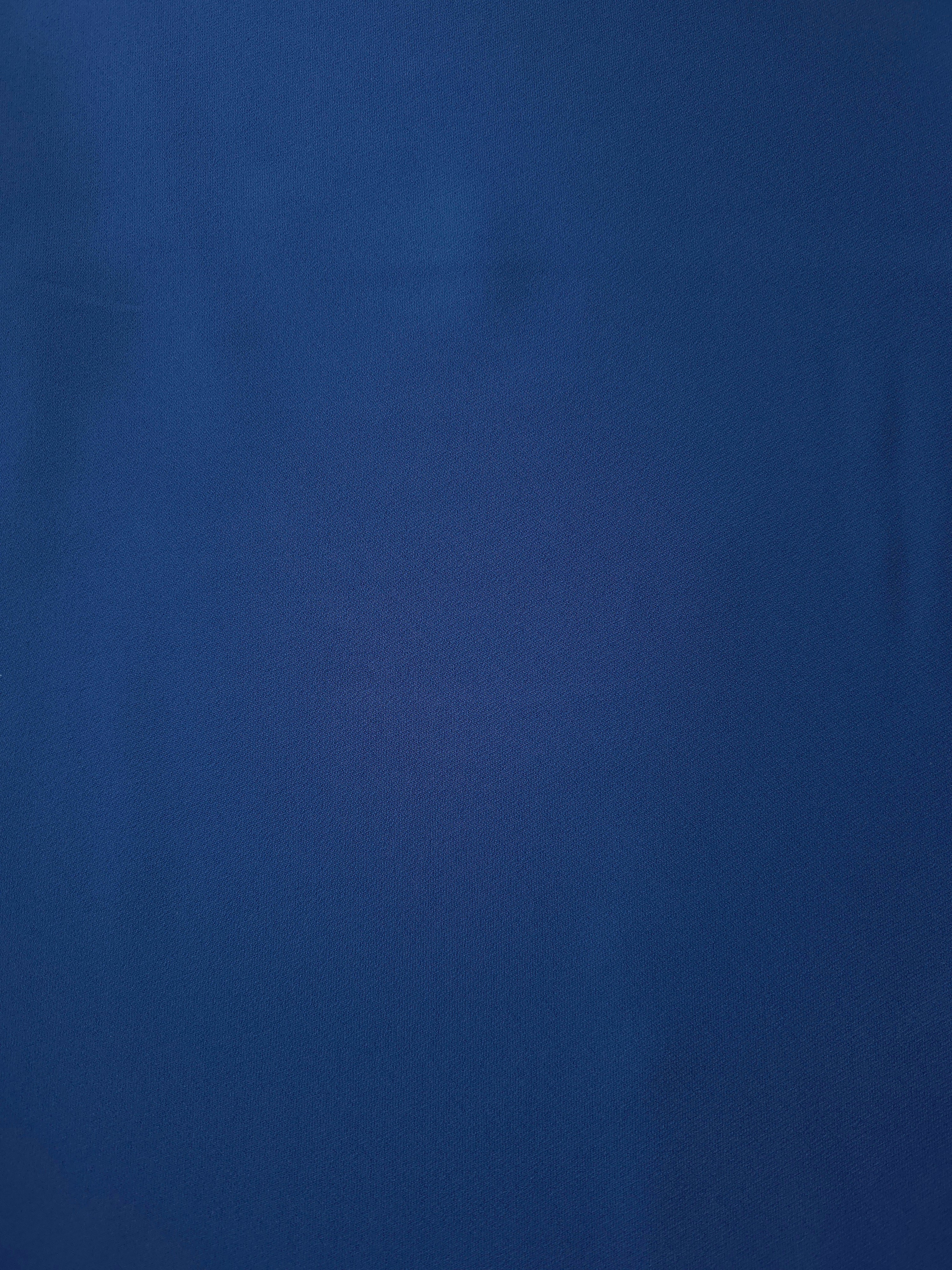 Indigo Navy Blue Italian polyester crepe shown flat, smooth apparel fabric for dresses and elegant separates