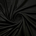 Swirled Jet Black metallic foiled spandex showing fluid movement and luminous sheen for dresses, dancewear and stage costumes