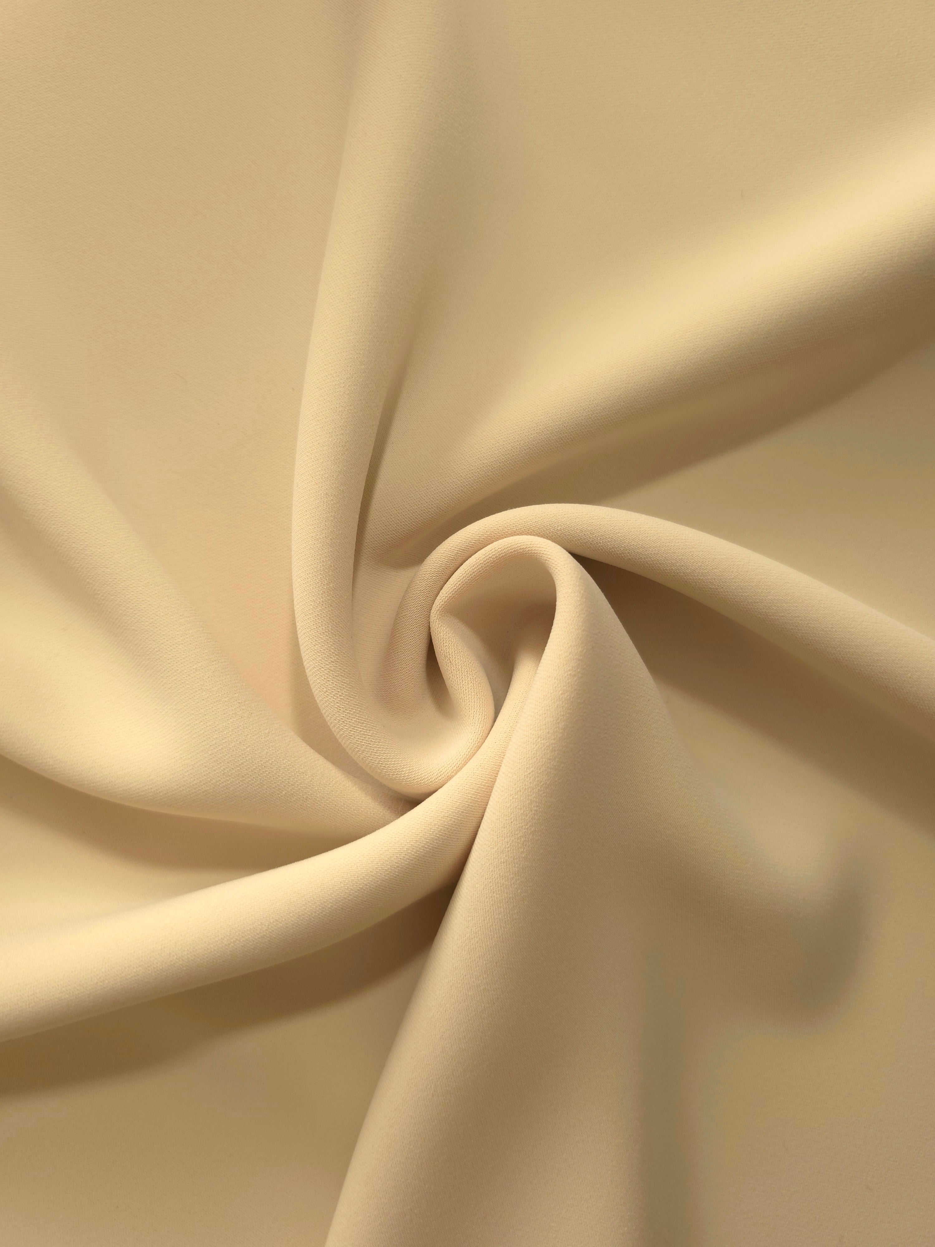Swirled Khaki Beige polyester crepe showing supple movement and soft drape for dresses and occasionwear