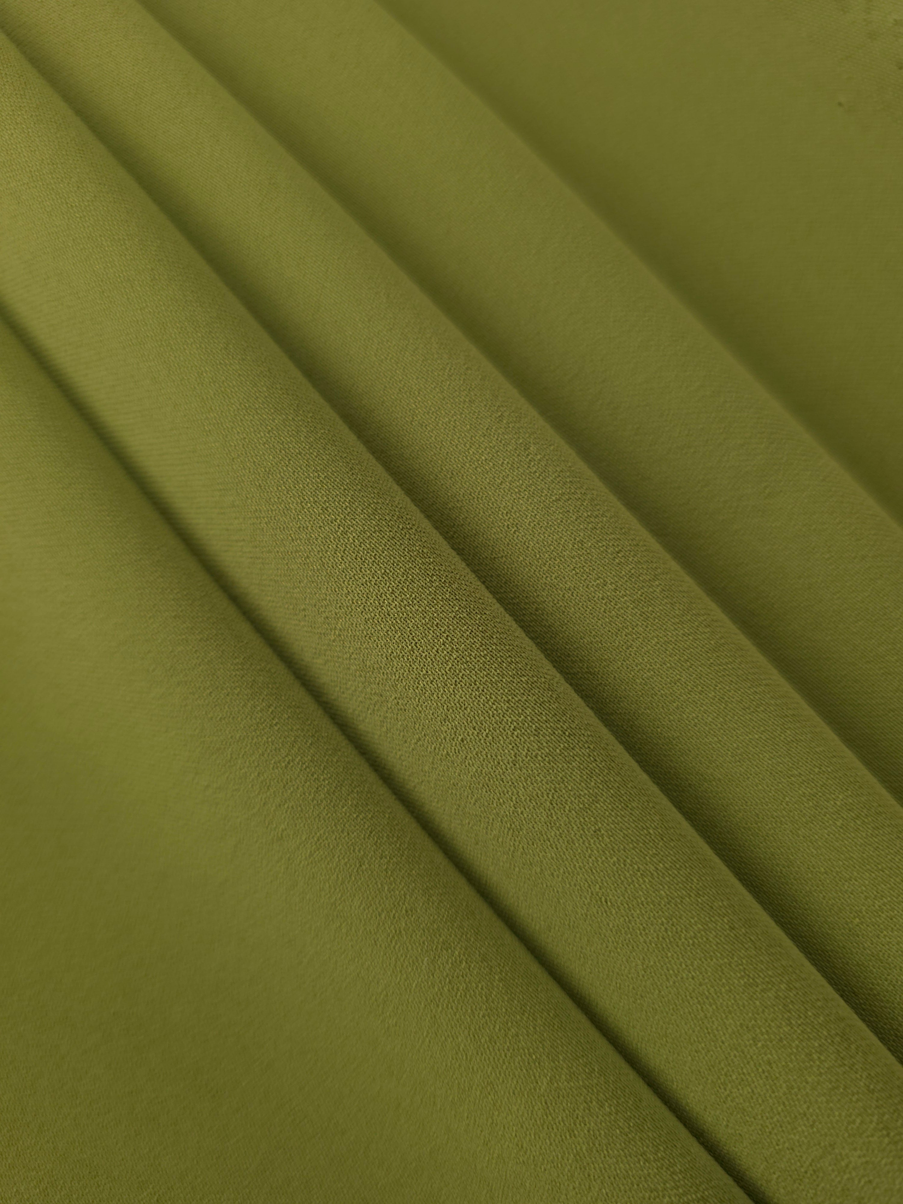 Khaki Olive Green Korean crepe in layered folds, showing soft structure and slight mechanical stretch for skirts