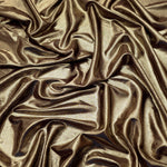 Flowing folds of Khaki Taupe metallic foiled spandex, showing shimmer and drape for dancewear, party dresses and performance fashion