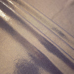 Layered folds of Lavender Taupe foiled stretch fabric showing shimmer, body and movement for performance outfits and statement garments