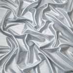 Softly draped Light Silver Gray foiled spandex fabric showing fluid shape and metallic shimmer for dresses, stage costumes and eventwear
