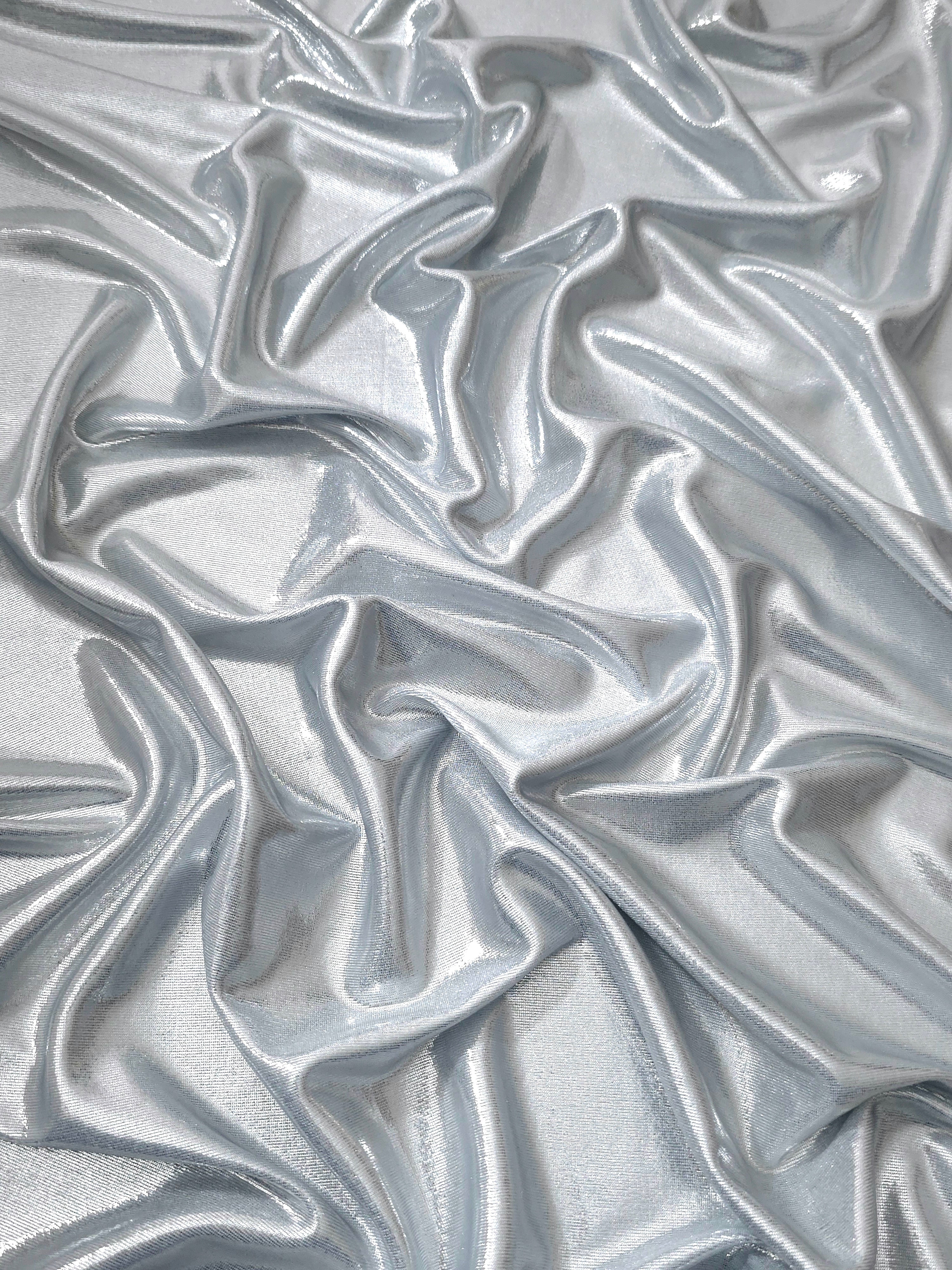 Softly draped Light Silver Gray foiled spandex fabric showing fluid shape and metallic shimmer for dresses, stage costumes and eventwear
