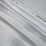 Light Silver Gray foiled spandex arranged in layered folds, displaying shimmer and soft structure for skirts, tops and performancewear