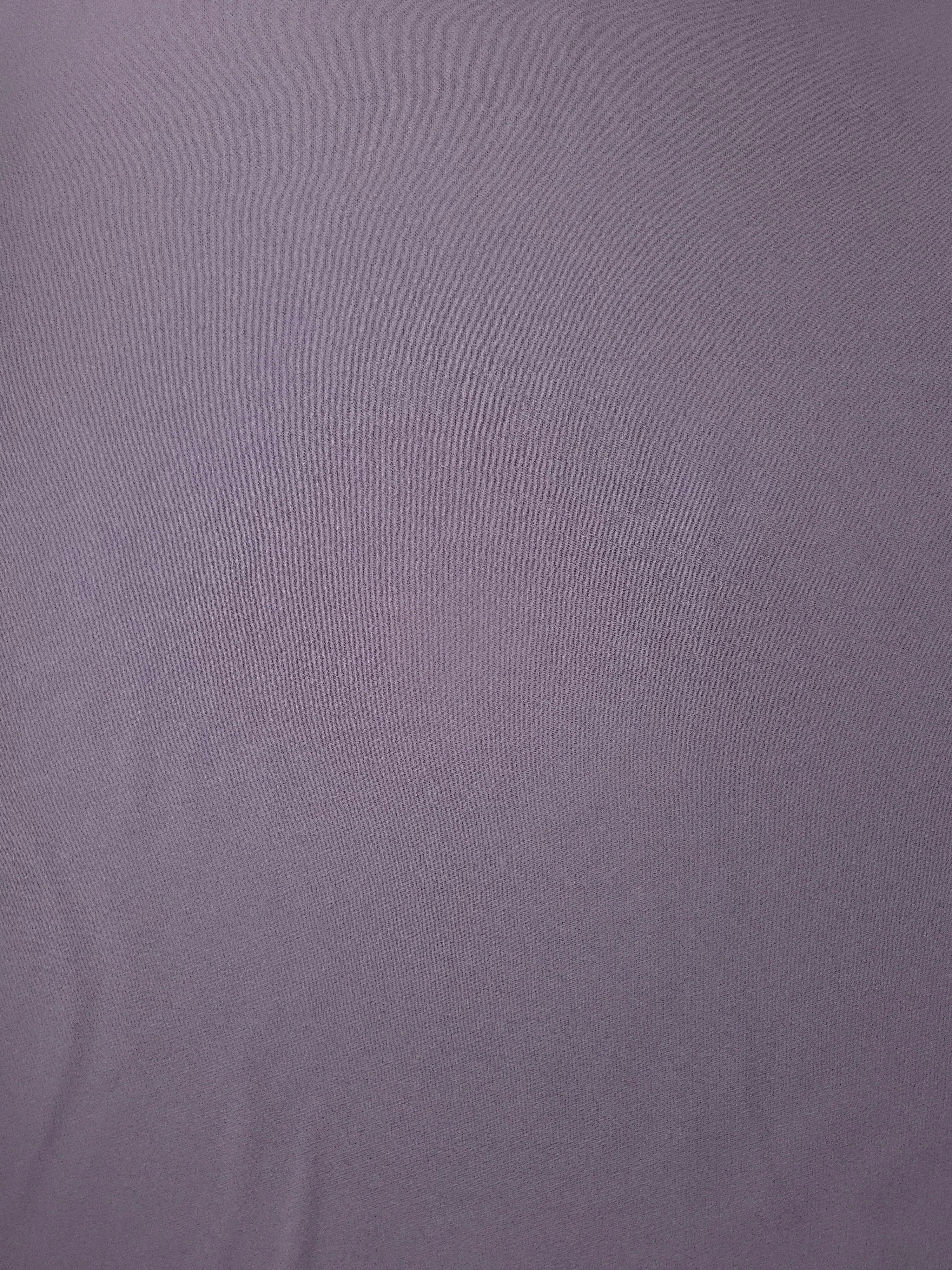 Flat surface of Mauve Gray Italian polyester crepe, smooth woven apparel fabric for dresses and separates