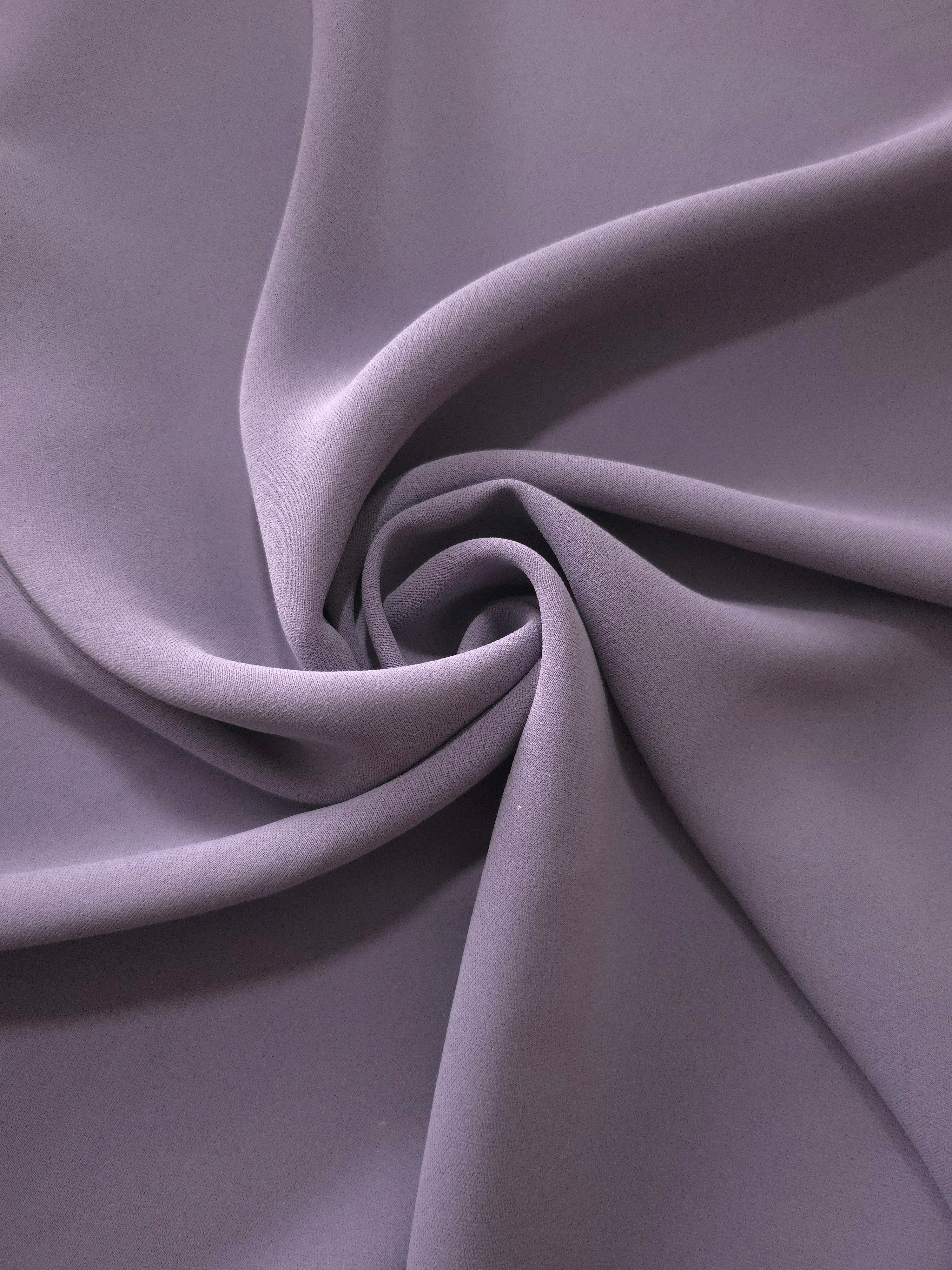 Circular drape of Mauve Gray polyester crepe showing flowing movement for abayas, dresses and modest fashion