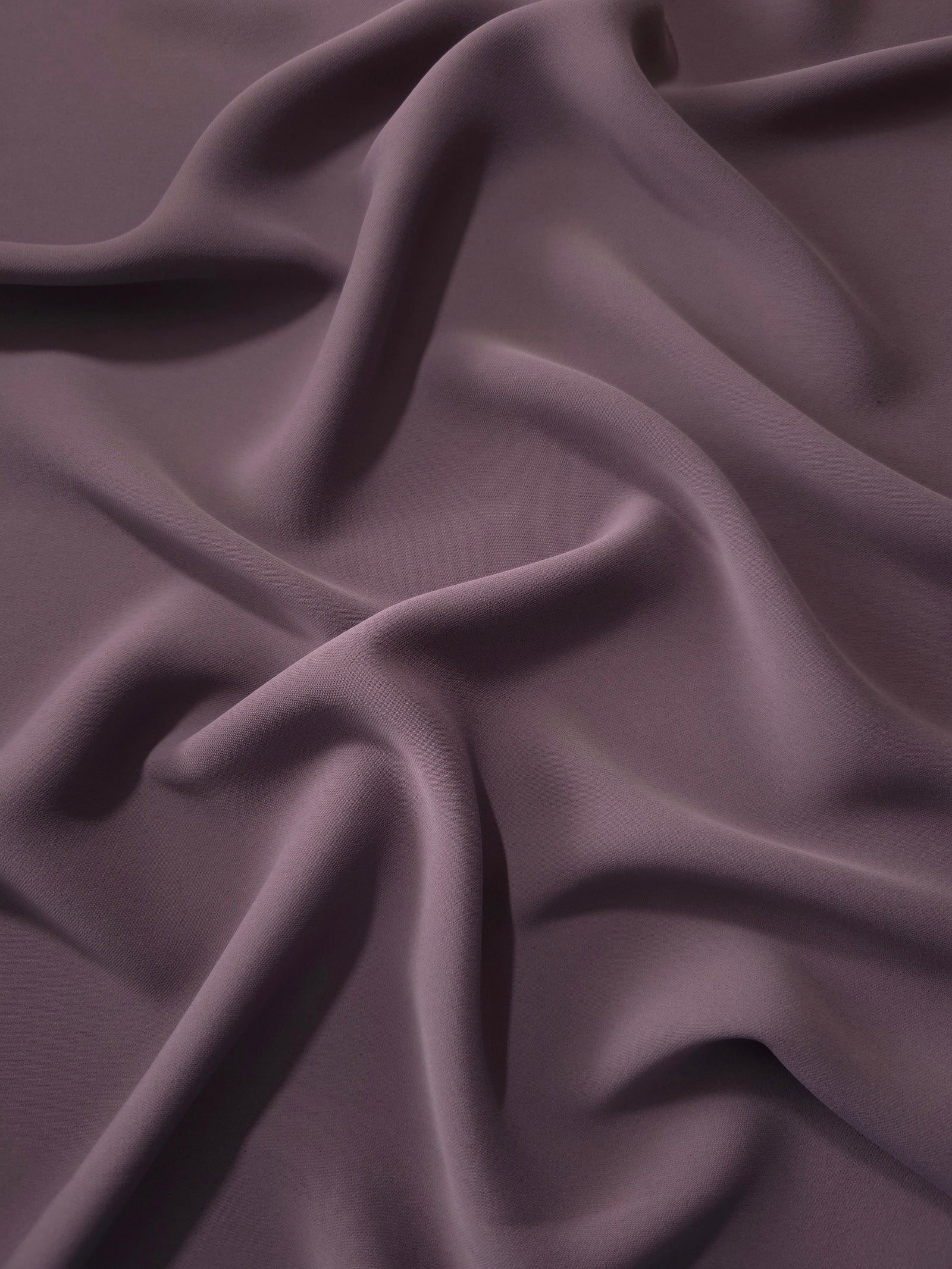 Fluid folds of Mauve Taupe opaque Korean crepe, a dress fabric suited to eveningwear and flowing skirts