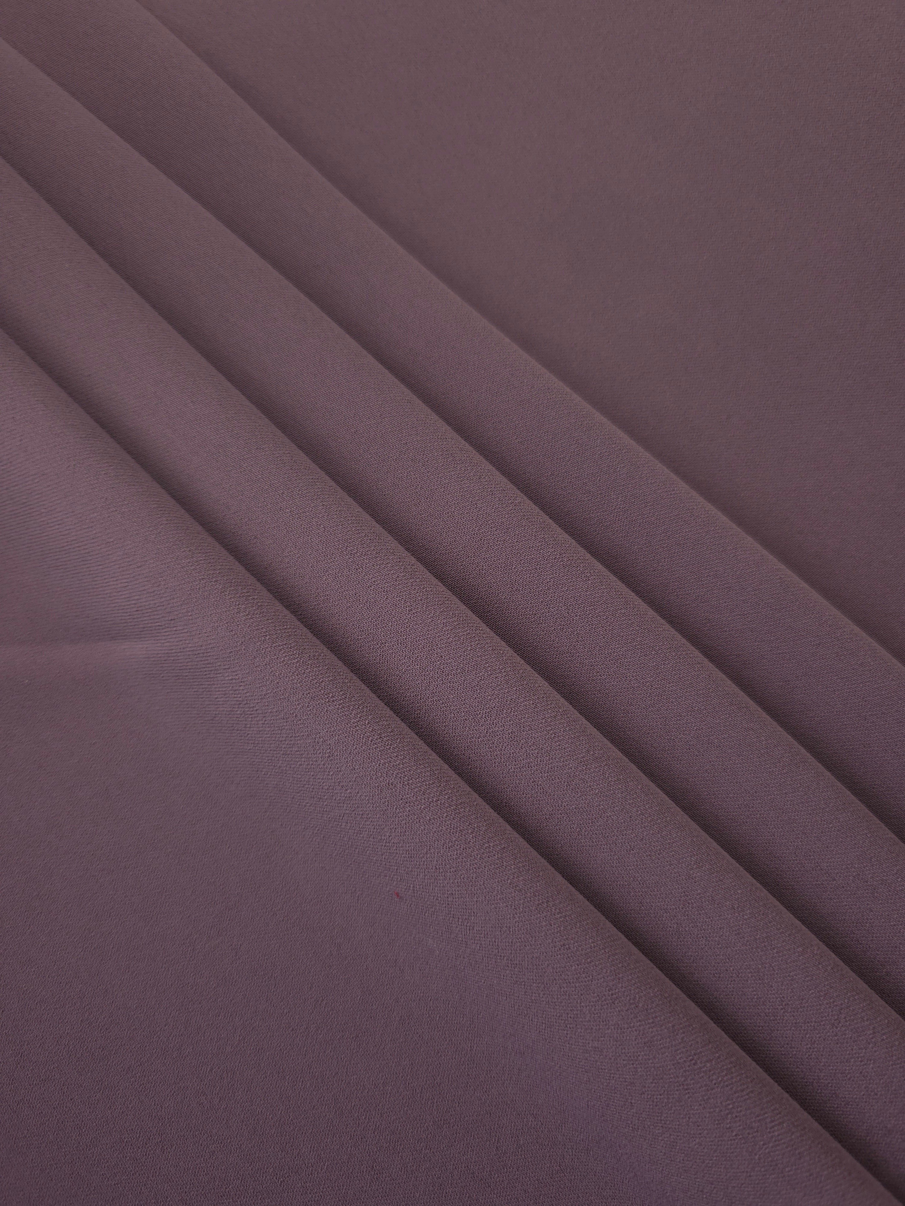 Layered folds of Mauve Taupe 100% mechanical polyester crepe showing body and gentle construction stretch