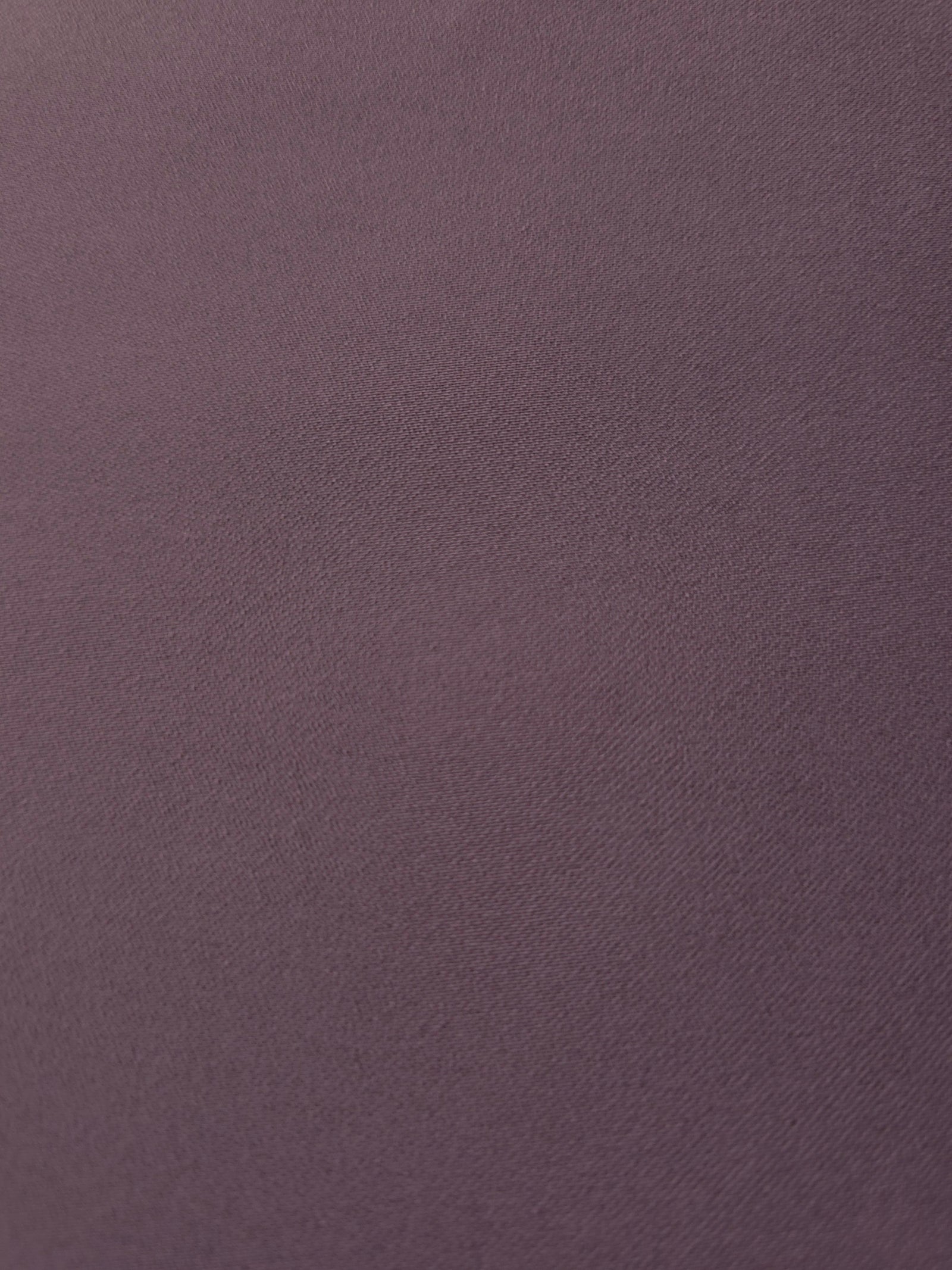 Texture detail of Mauve Taupe mechanical polyester crepe, a smooth woven fabric with a soft silky hand