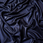 Midnight Navy Blue shimmer stretch fabric in draped folds, highlighting metallic foil sheen for evening dresses, costumes and statement apparel