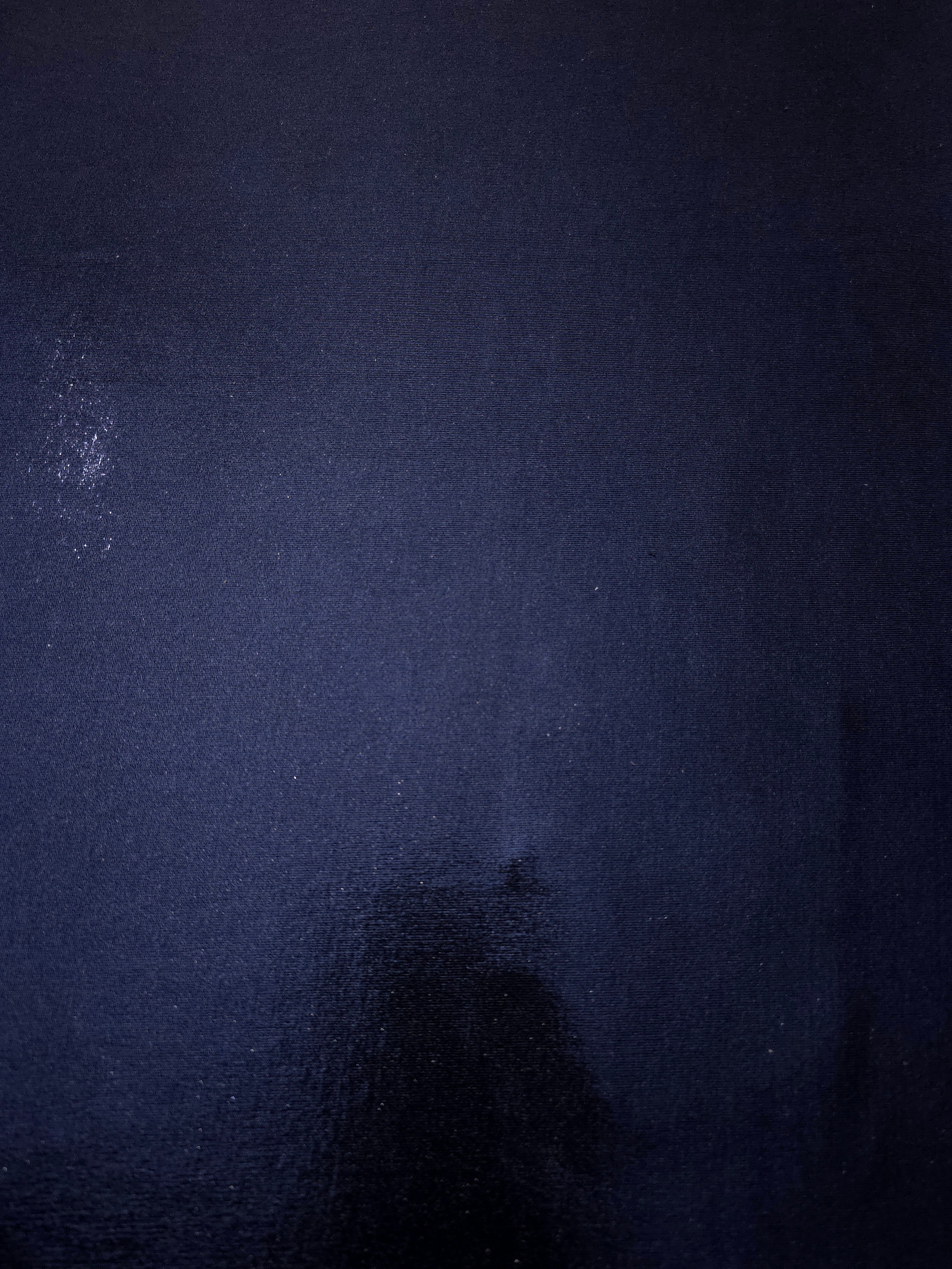 Flat view of Midnight Navy Blue shimmer stretch fabric showing its metallic foil surface for costumes, partywear and fashion apparel