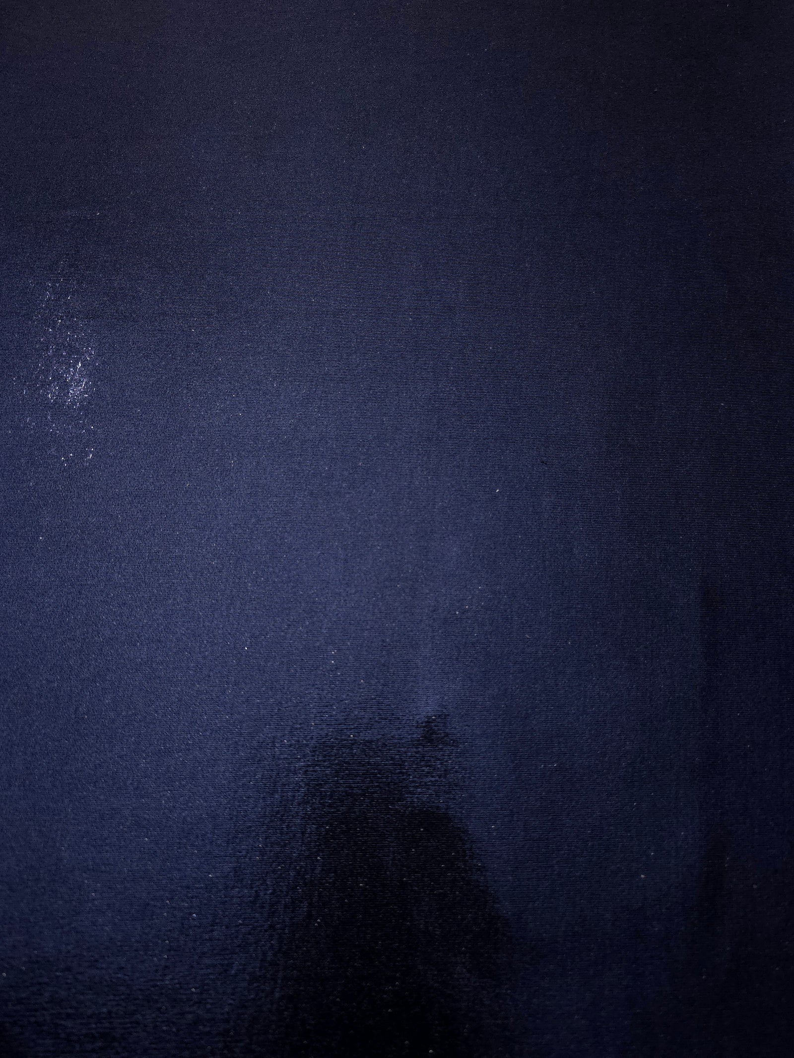 Flat view of Midnight Navy Blue shimmer stretch fabric showing its metallic foil surface for costumes, partywear and fashion apparel