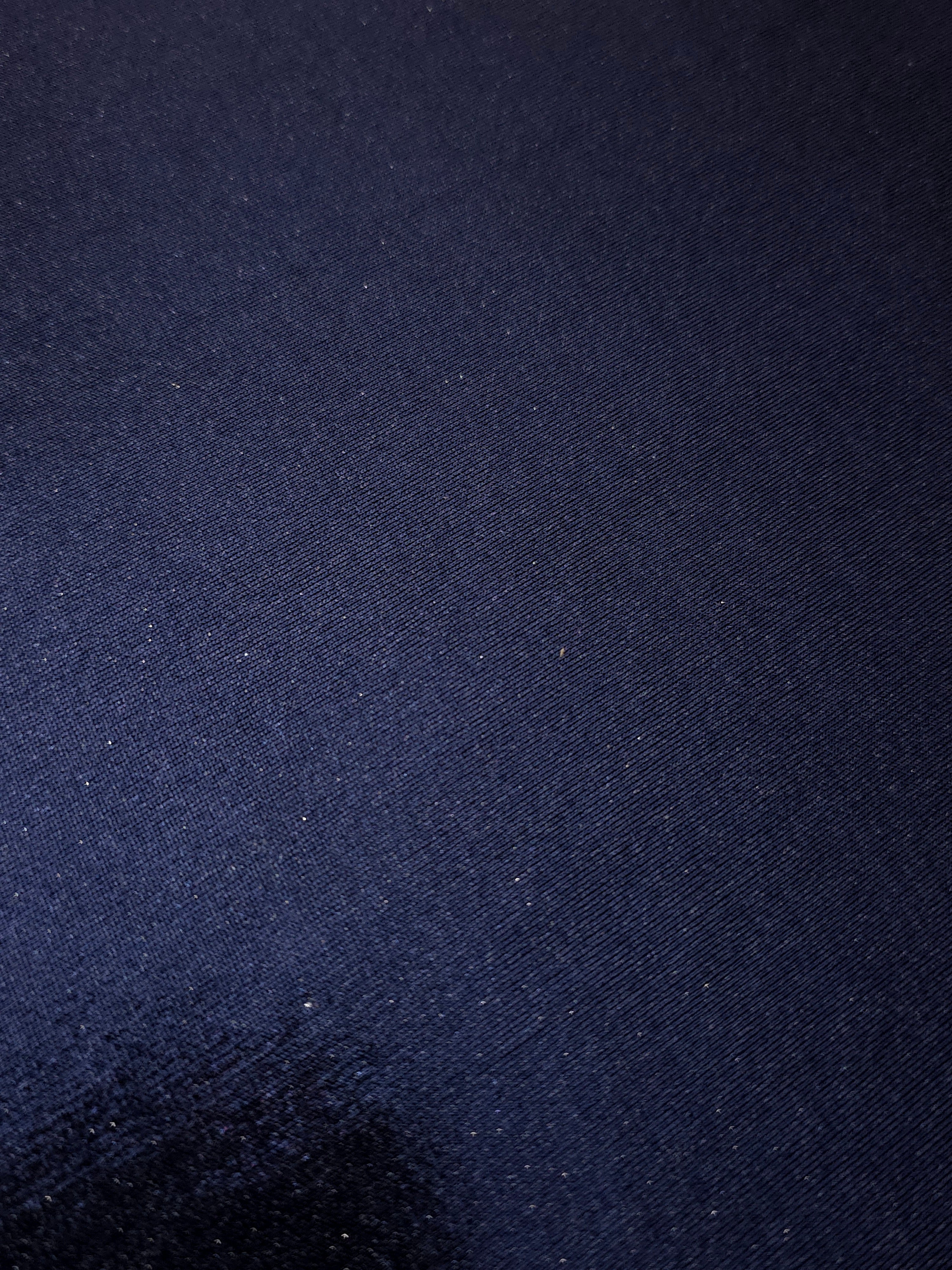Midnight Navy Blue shimmer stretch fabric close-up, revealing metallic foil texture and reflective detail for fashion and costume sewing