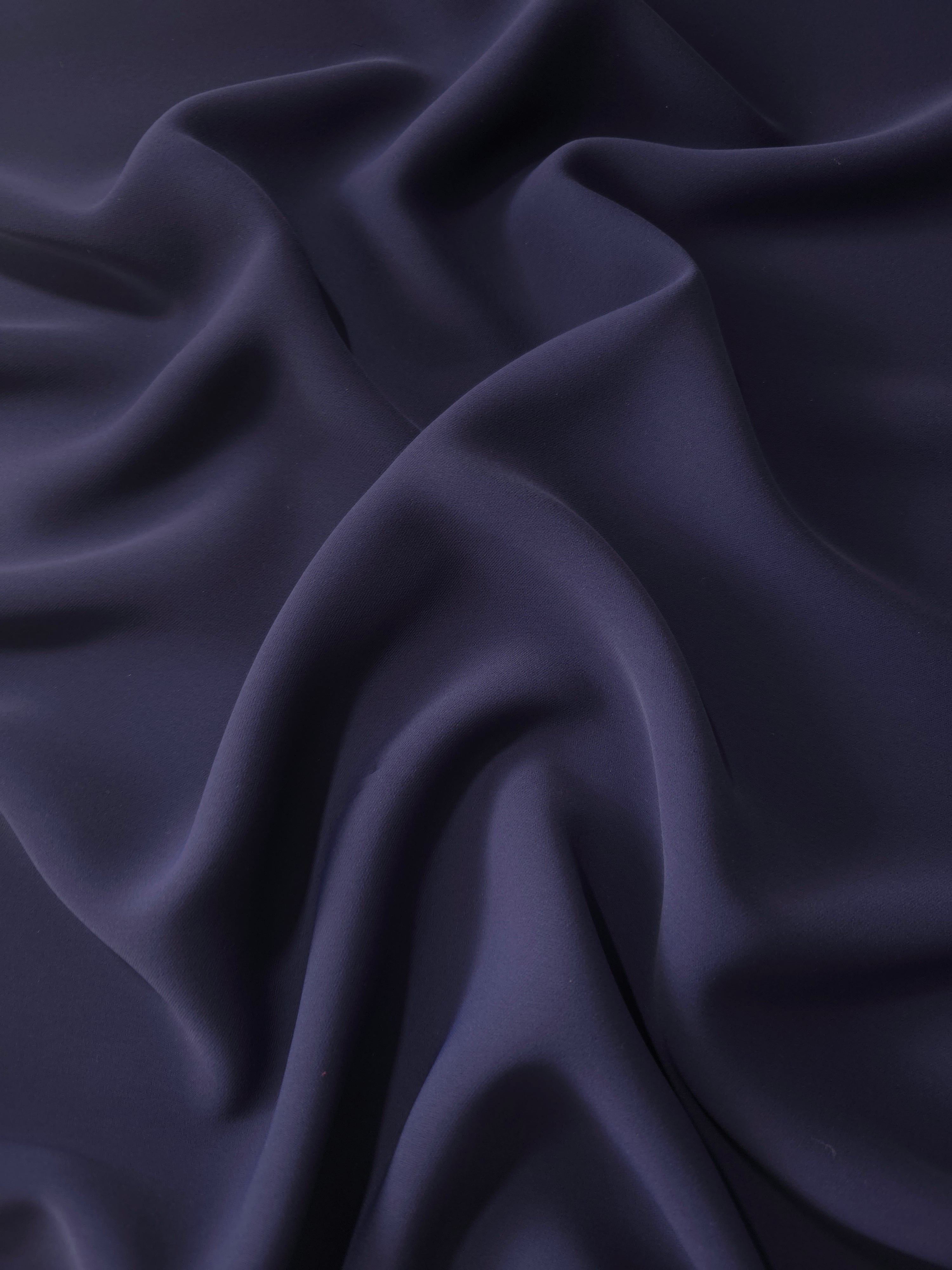 Draped Midnight Navy Purple polyester crepe showing fluid folds for evening dresses, occasionwear and elegant apparel