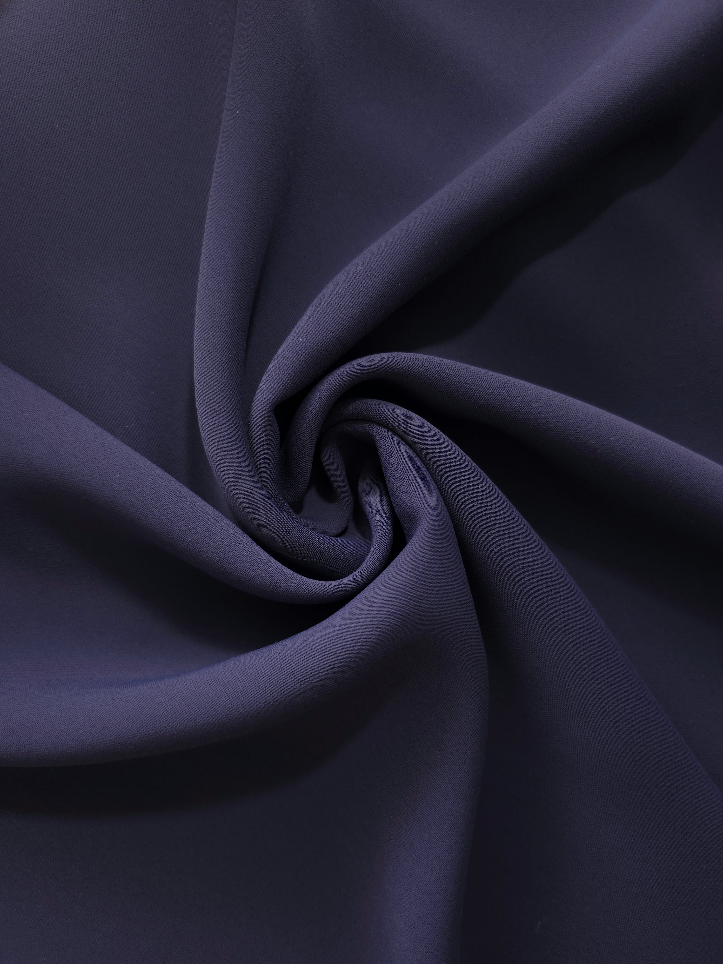Midnight Navy Purple silky-feel polyester crepe in a flowing swirl, showing drape for abayas and modest fashion