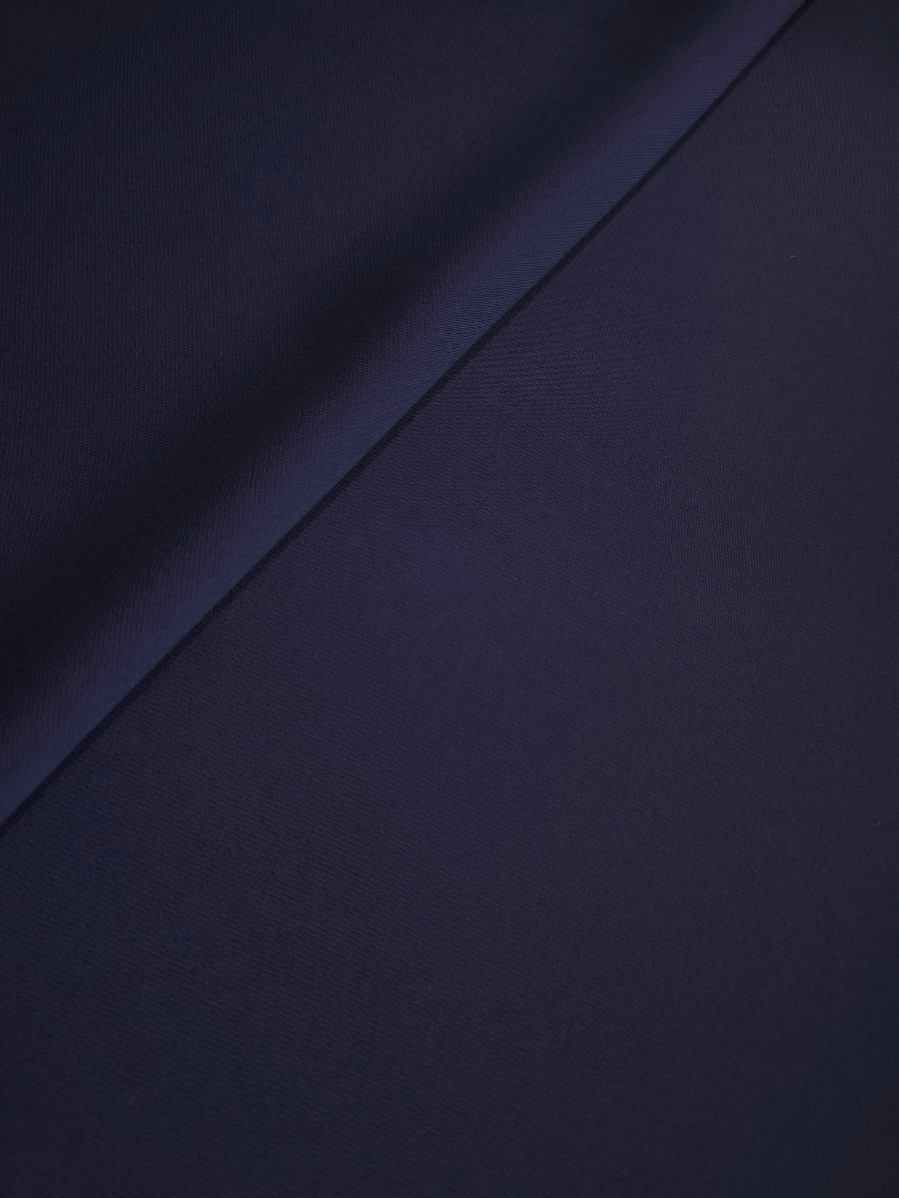 Midnight Navy Purple Italian crepe in a soft fold, showing fluid drape for blouses, dresses and flowing skirts