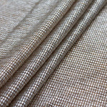 Flat lay of Moonlight gold shimmer stretch tulle fabric with silver foil accents