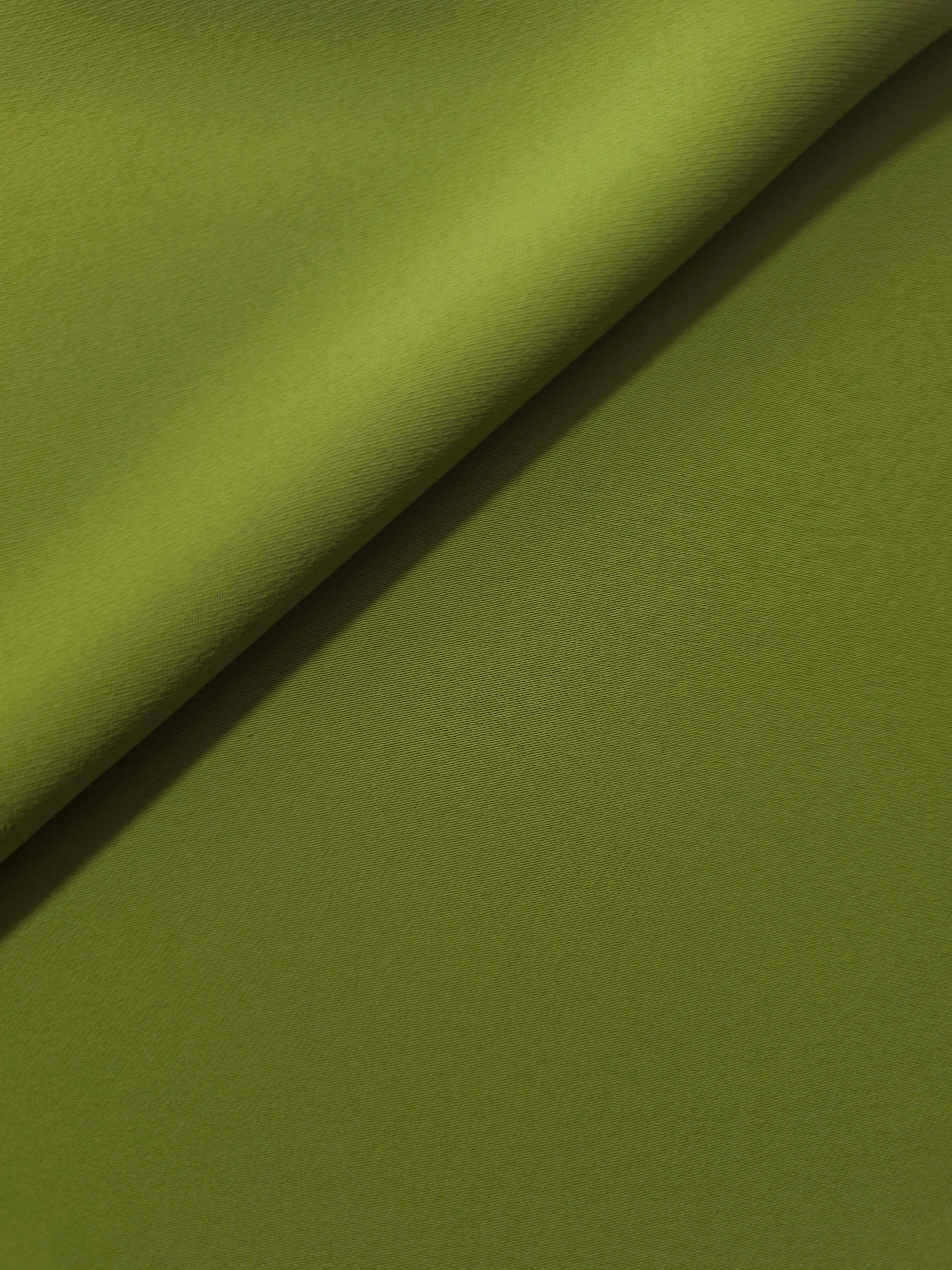 Moss Green silky-soft Korean crepe folded loosely to show fluid drape for blouses and occasionwear separates