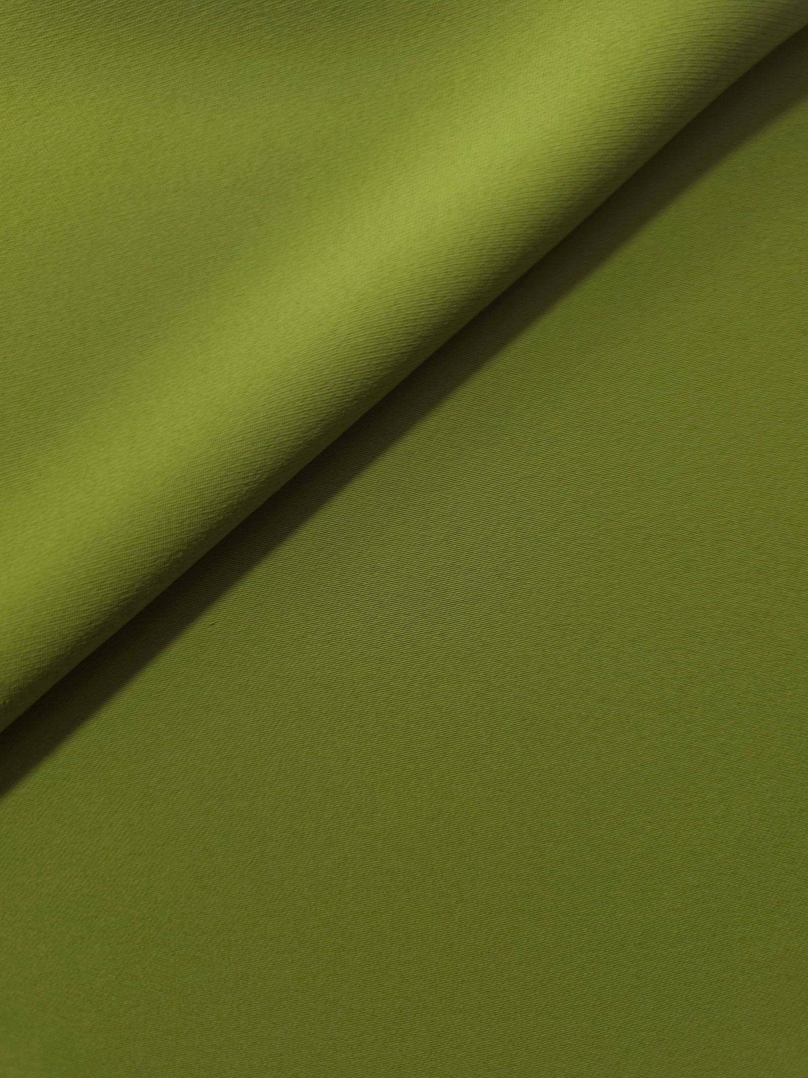 Moss Green silky-soft Korean crepe folded loosely to show fluid drape for blouses and occasionwear separates