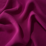 Draped Mulberry Purple Korean polyester crepe showing opaque fluid folds for evening dresses and occasionwear