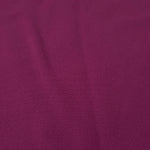 Close-up of Mulberry Purple 100% mechanical polyester crepe showing fine woven texture and a silky-soft hand feel
