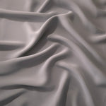 Draped Mushroom Greige Korean polyester crepe showing opaque fluid folds for evening dresses and occasionwear
