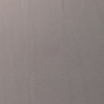 Close-up of Mushroom Greige 100% mechanical polyester crepe showing fine woven texture and a silky-soft hand feel