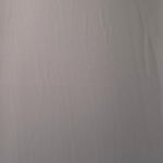 Mushroom Greige 205 GSM Korean polyester crepe shown flat, an opaque smooth woven dress fabric with a silky-soft finish