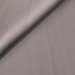 Mushroom Greige Korean polyester crepe in a soft fold, showing fluid drape for blouses and flowing dresses