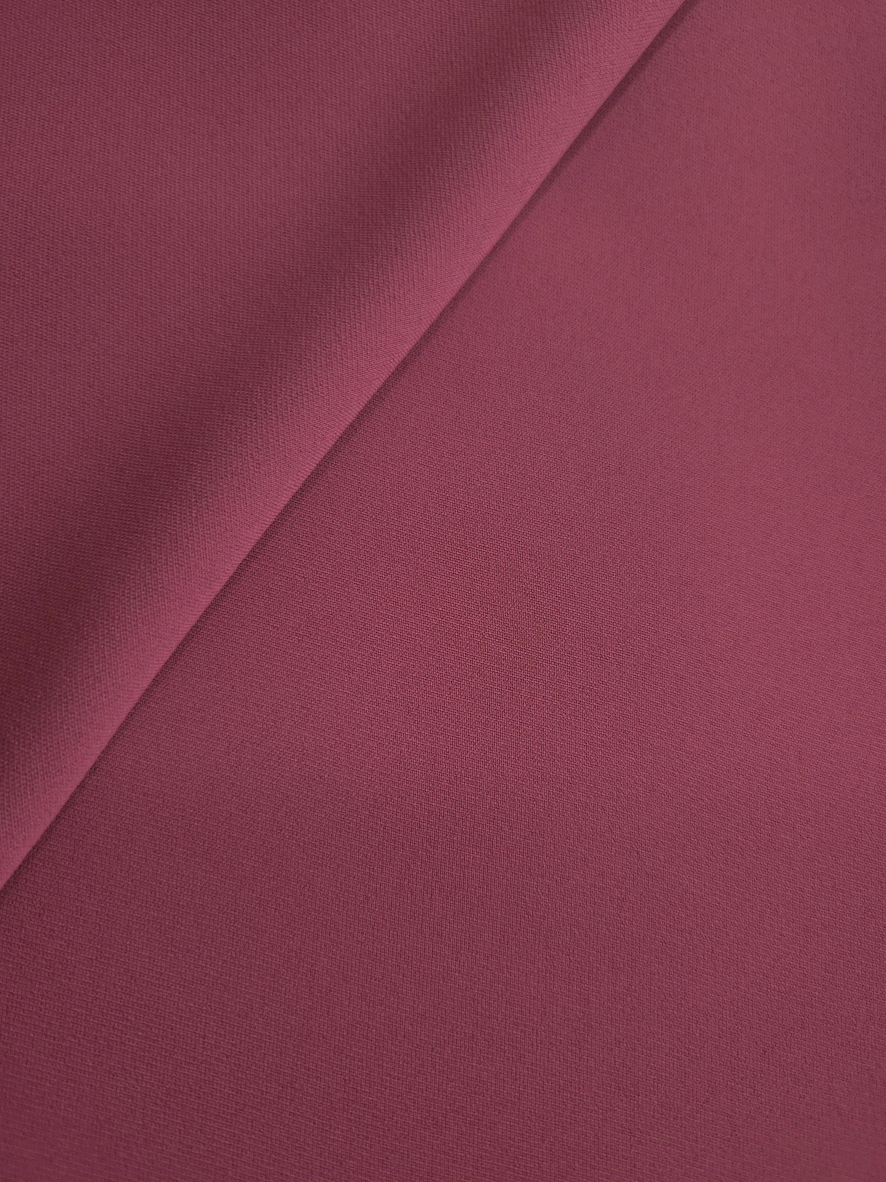 Soft-fold view of Muted Wine Red Italian polyester crepe showing fluid drape for blouses, skirts and dresses